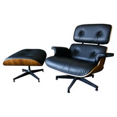 Charles Eames 670 Lounge Chair and 671 Ottoman in Black Leather and Walnut, 2015