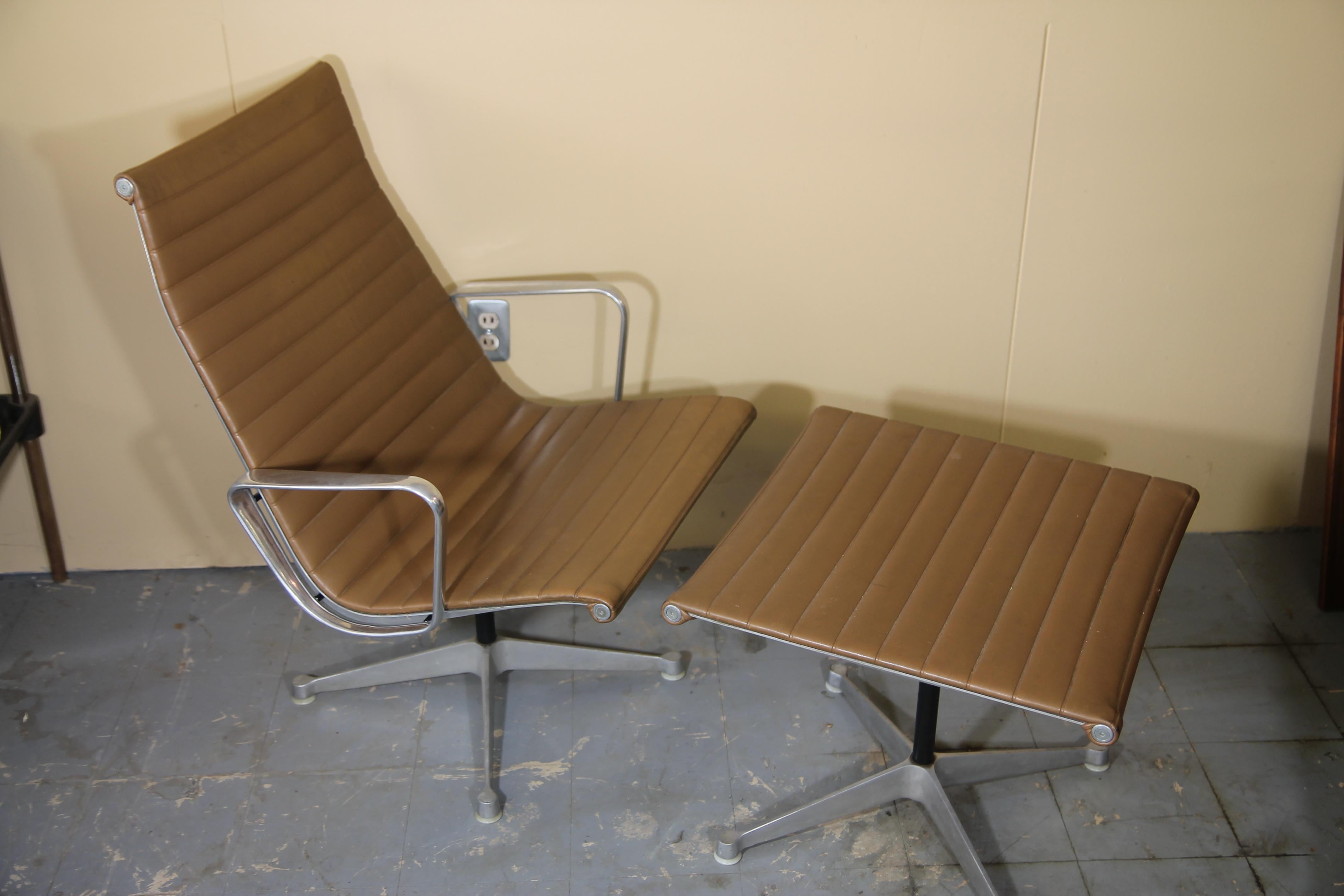 Vintage Eames aluminum group lounge chair and rarely seen ottoman.