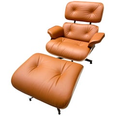 Fauteuil de salon et pouf Charles Eames Cognac, Herman Miller, 2011