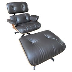 Charles Eames Dark brown Lounge Chair 
Ottoman, Herman Miller, 2011