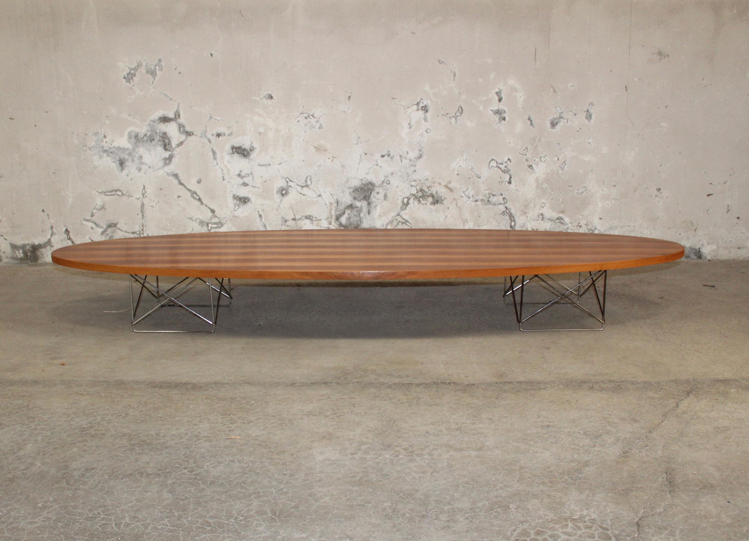 Elliptical table rod (ETR) surfboard table, Herman Miller
USA, 1951
10 x 89 x 29.25 in. (25.4 x 226.1 x 74.3 cm.)
literature: Eames Design: The Work of the Office of Charles and Ray Eames, Neuhart, Neuhart and Eames, pg. 149 
walnut america in