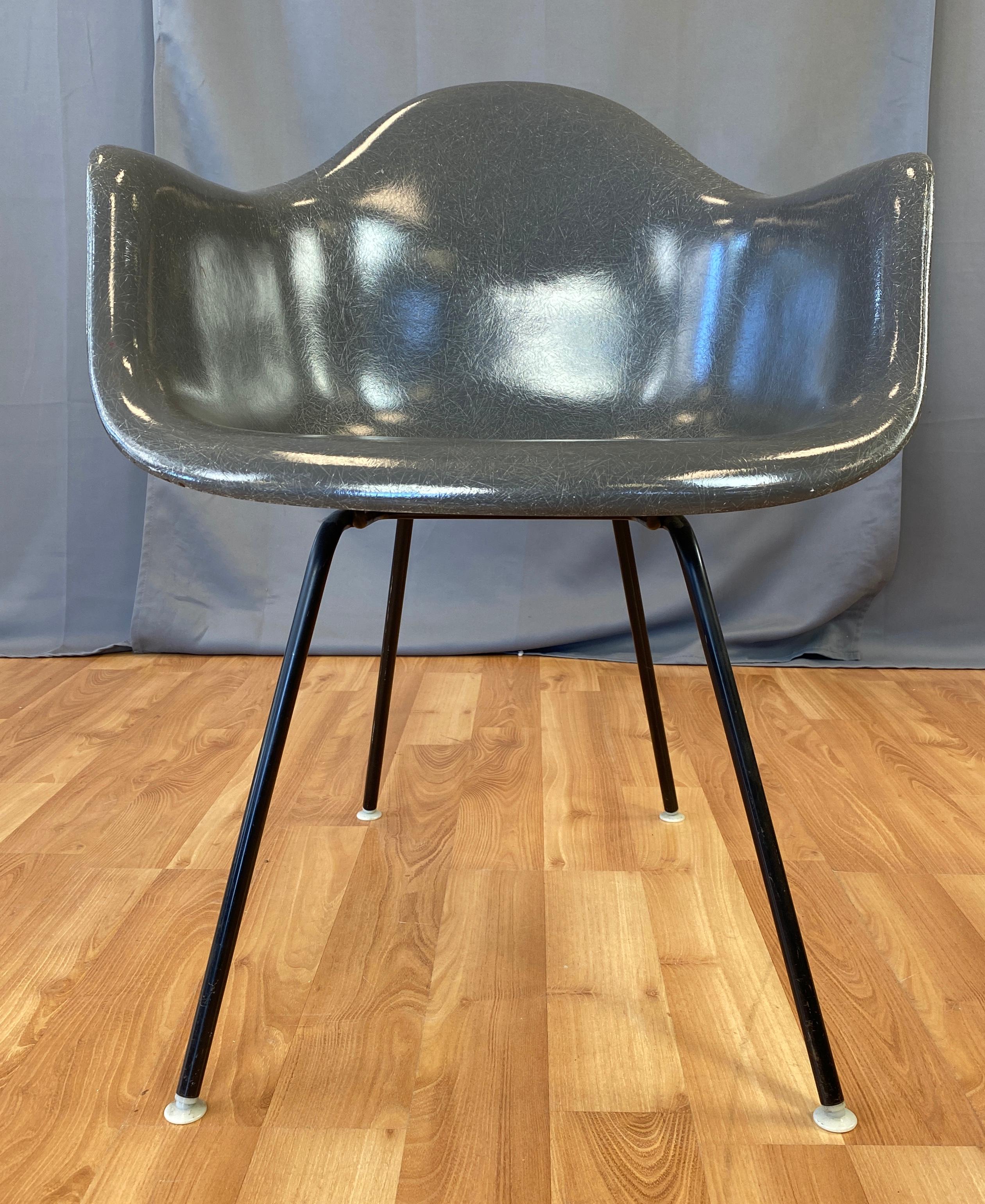 A Charles Eames designed fiberglass shell armchair for Herman Miller, this one has the rare flame logo.
Made between 1959 and 1960.