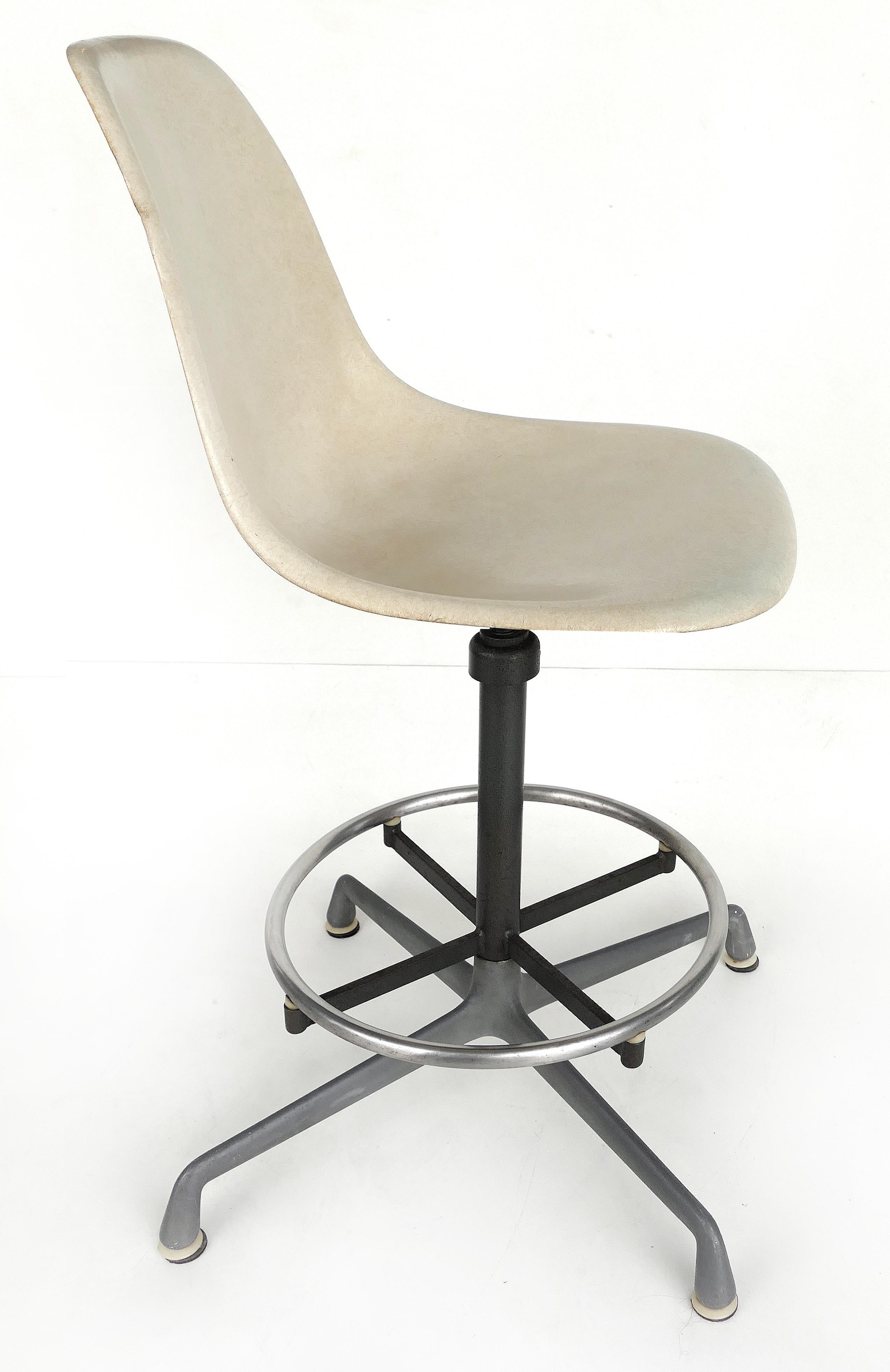 Charles Eames for Herman Miller bar/counter stools in molded fiberglass, circa 1960s

Offered for sale is a pair of Charles Eames designs for Herman Miller molded fiberglass swivel bar/counter stools with adjustable seat heights, in very good