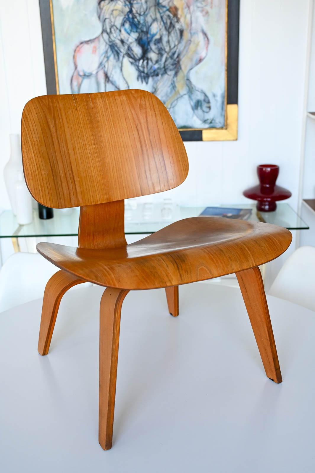 Charles Eames for Herman Miller LCW in Ash, ca. 1952.  Early original with Herman Miller foil label.  Chair is in immaculate condition with all original shock mounts.  No chips or warping of bent wood and the chair sits very solid. Very well cared