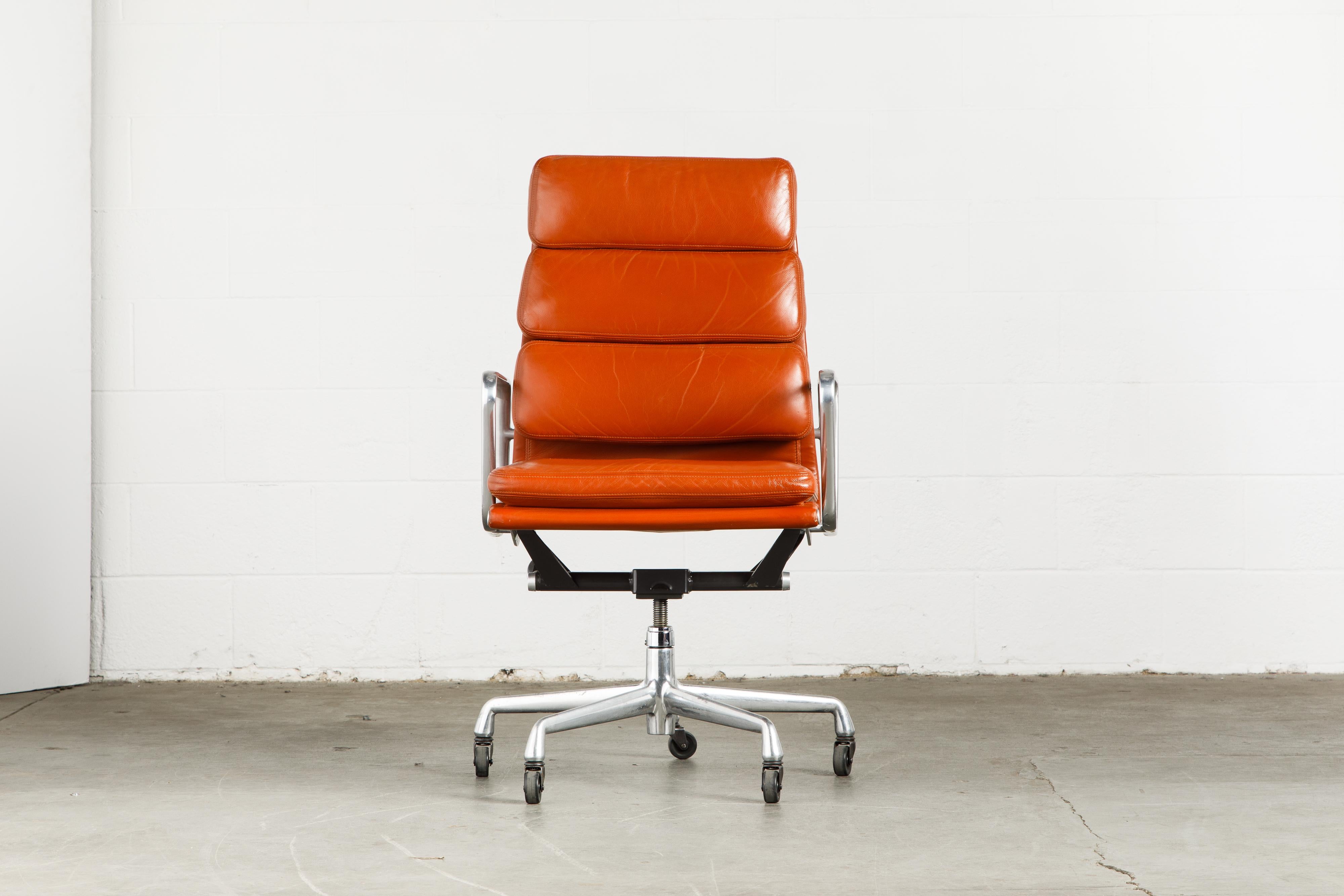 Incredible leather on these six Charles and Ray Eames for Herman Miller high-back 'Soft Pad' executive desk chairs. The light patina and aging to the cognac color leather provides a soft patina that is attractive and adds greater complexity to the