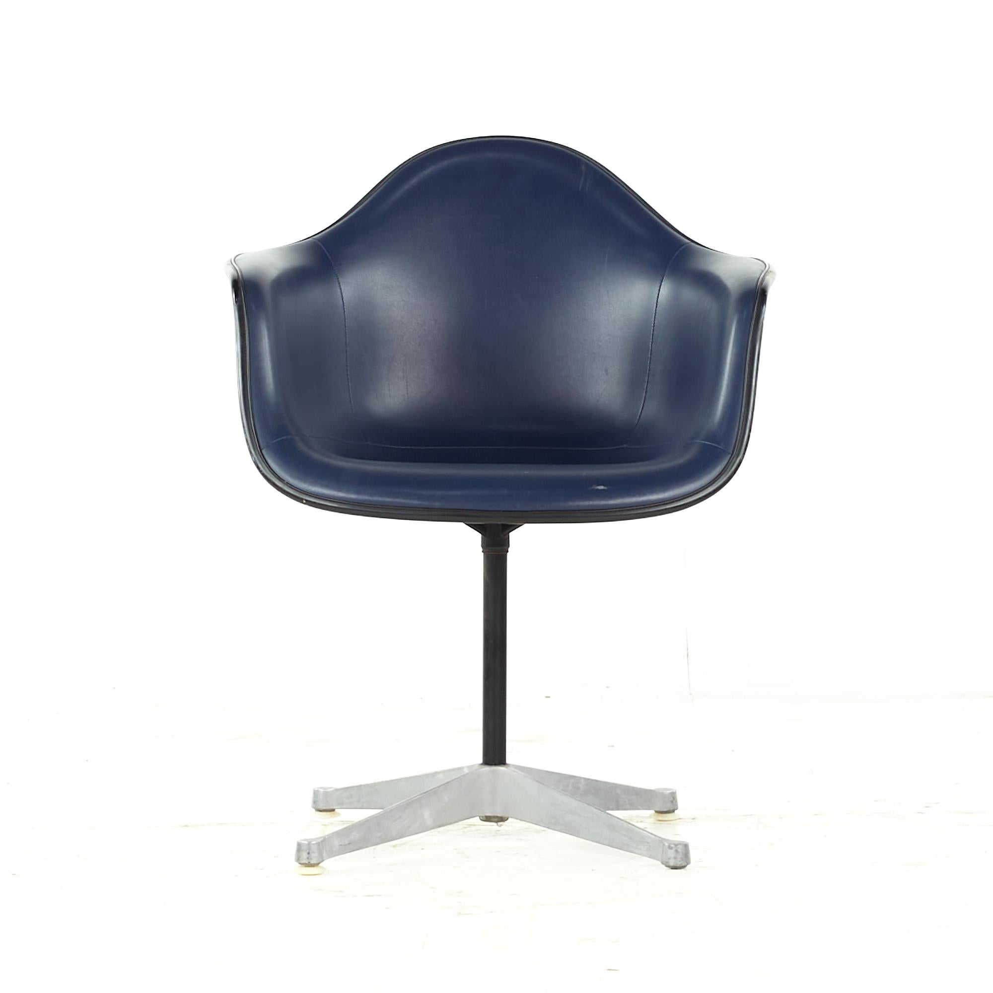 Charles Eames for Herman Miller Mid Century upholstered shell office chair

This chair measures: 25 wide x 22 deep x 32 high, with a seat height of 18 and arm height/chair clearance 26.5 inches

All pieces of furniture can be had in what we call