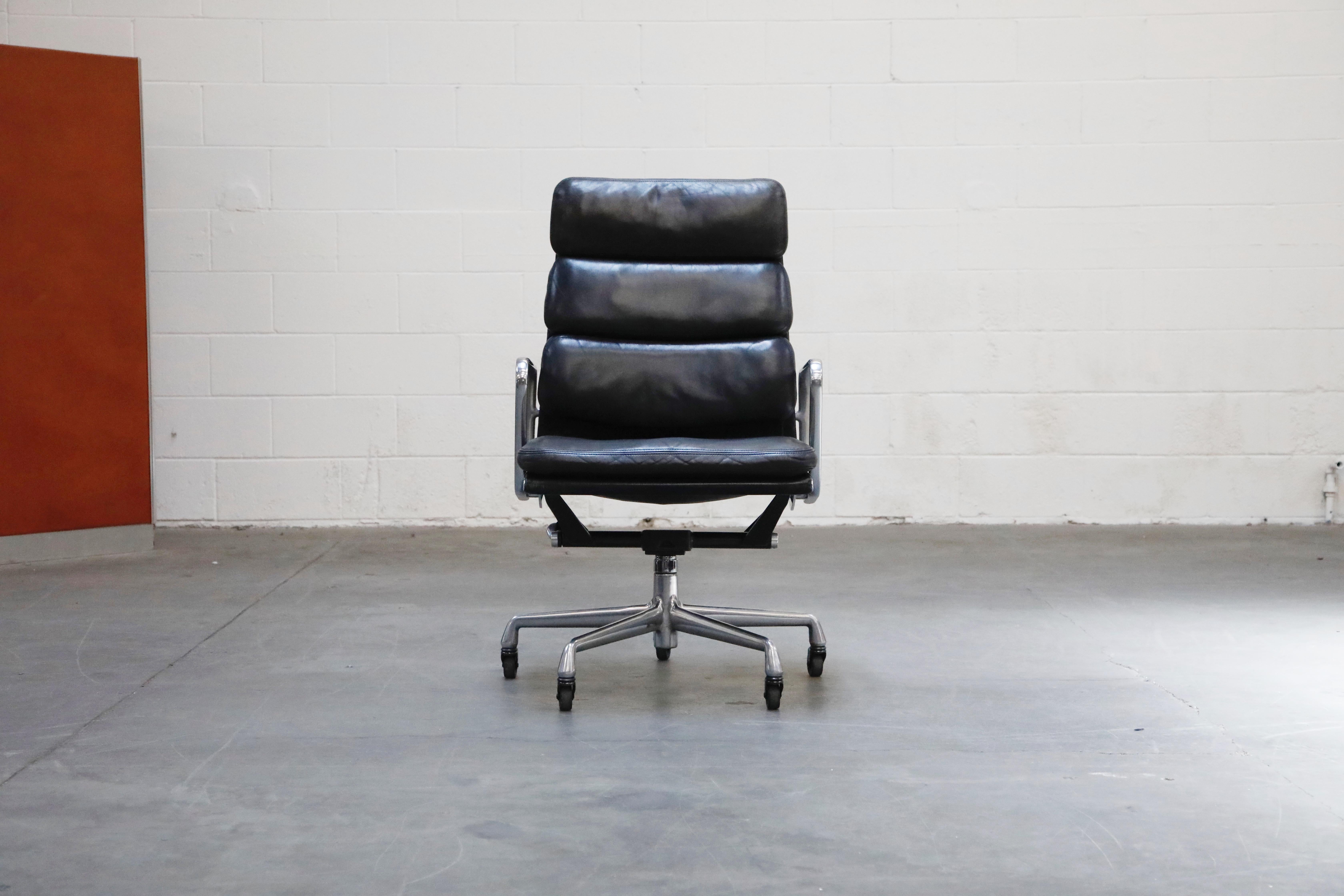 Incredible leather on this set of fourteen (14) very collectible, Charles and Ray Eames for Herman Miller high-back 'Soft Pad' executive desk chairs. The light aging to the dark charcoal / light black color leather provides a soft patina that is so