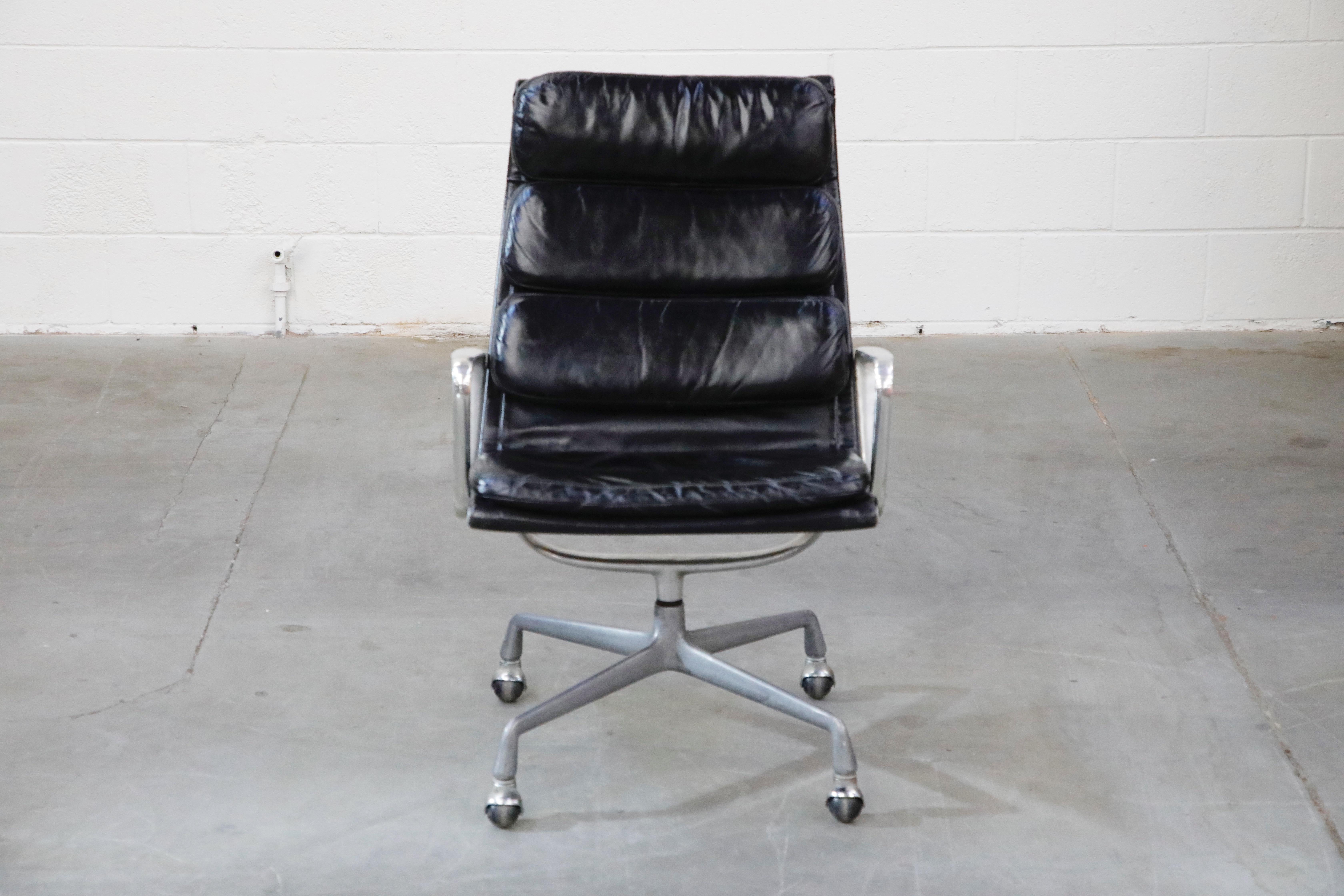 Incredible black leather on this set of five (5) early year production, very collectible, Charles and Ray Eames for Herman Miller high-back executive soft pad swivel lounge chairs. The light aging to the leather provides a soft patina that is so