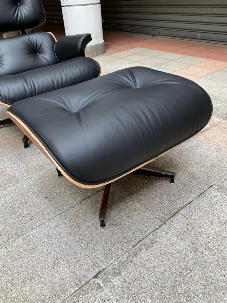 Contemporary Charles Eames, Lounge Chair and Its Black Leather and Rosewood Ottoman, 2011 For Sale