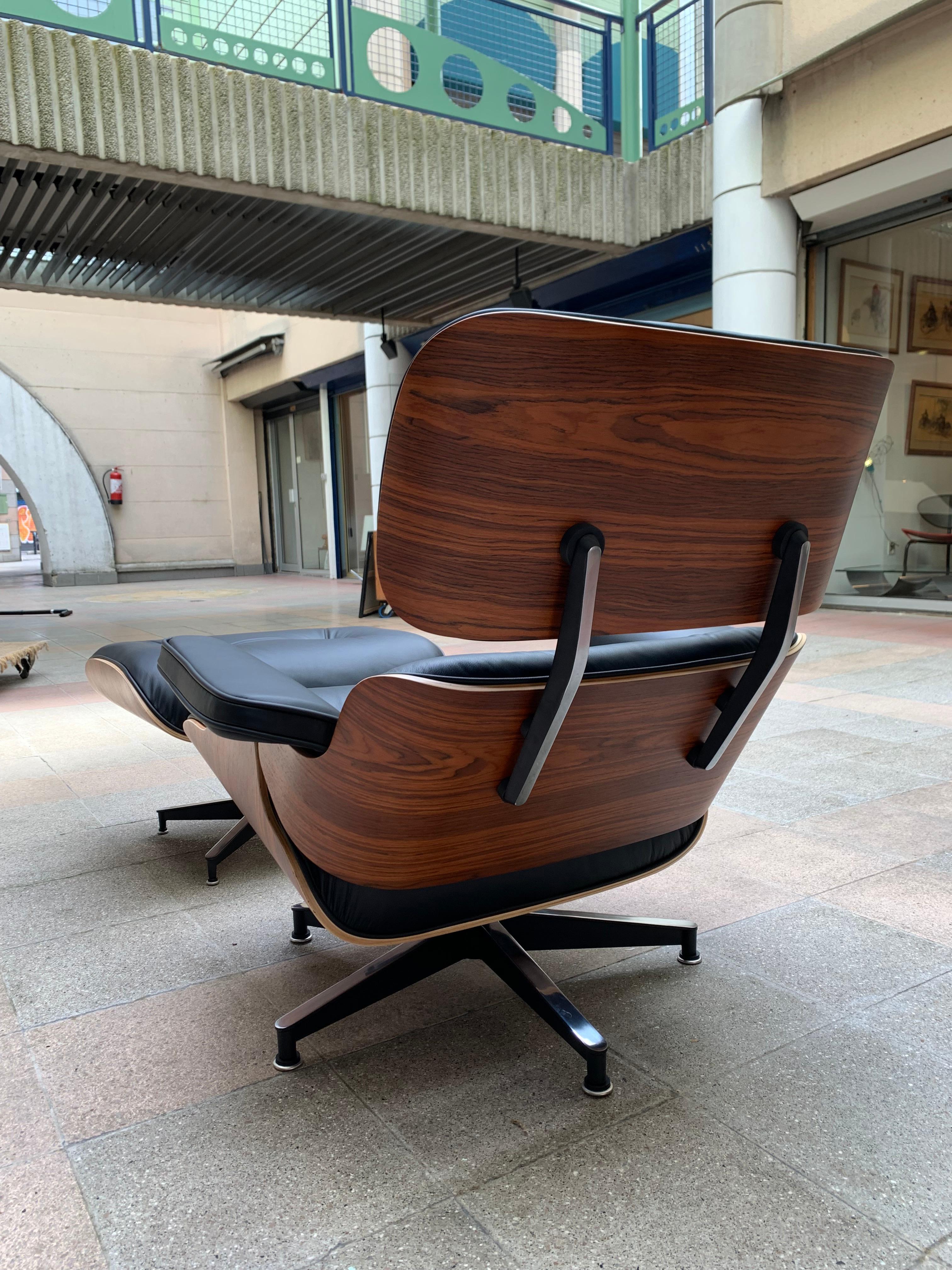 American Charles Eames, Lounge Chair and Its Black Leather and Rosewood Ottoman, 2011