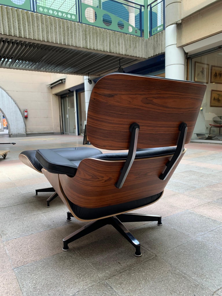 Charles Eames, Lounge Chair and Its Black Leather and Rosewood Ottoman, 2011 For Sale 1
