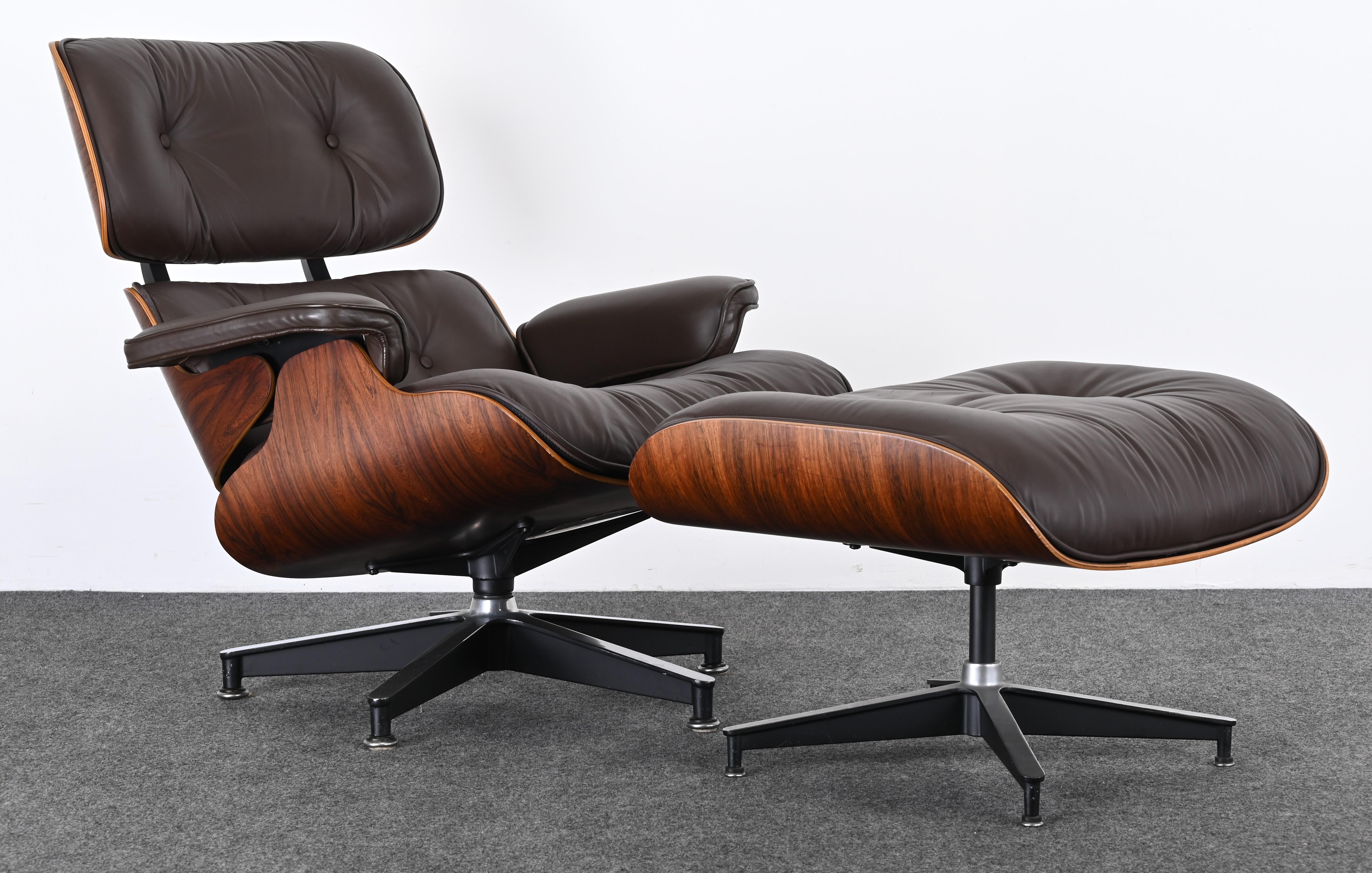 A gorgeous rosewood Charles Eames Lounge Chair and Ottoman in chocolate brown leather, Third generation 1977. Beautiful rosewood veneer and chocolate brown leather that has been reconditioned. This chair is spectacular and one of the best we have
