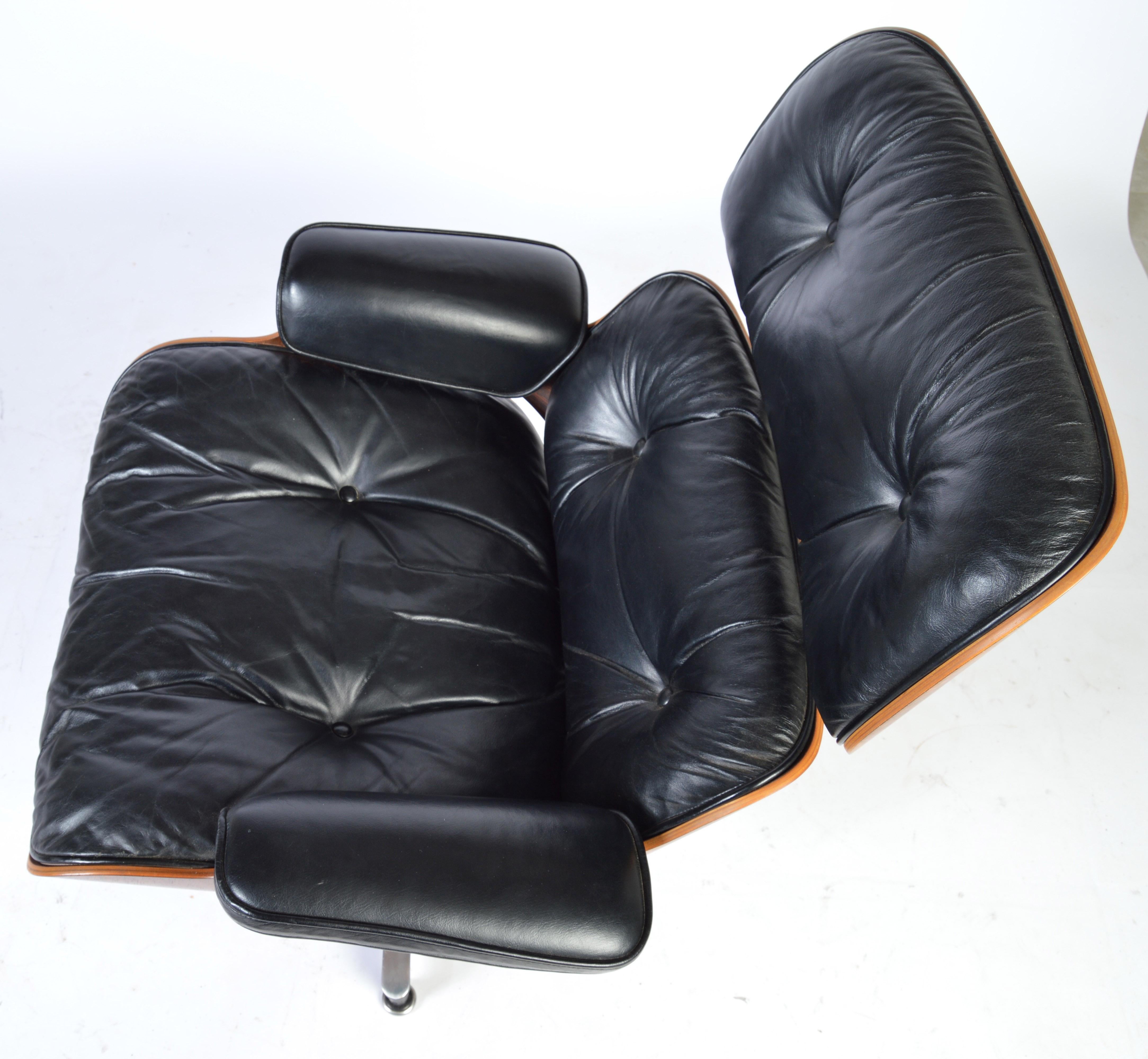 A beautiful 1970s Eames rosewood 670 lounge chair having black leather upholstery with original Herman Miller label's. 
Leather upholstery is in stunning condition. 
 2 professionally executed small hole repairs are slightly visible underneath of