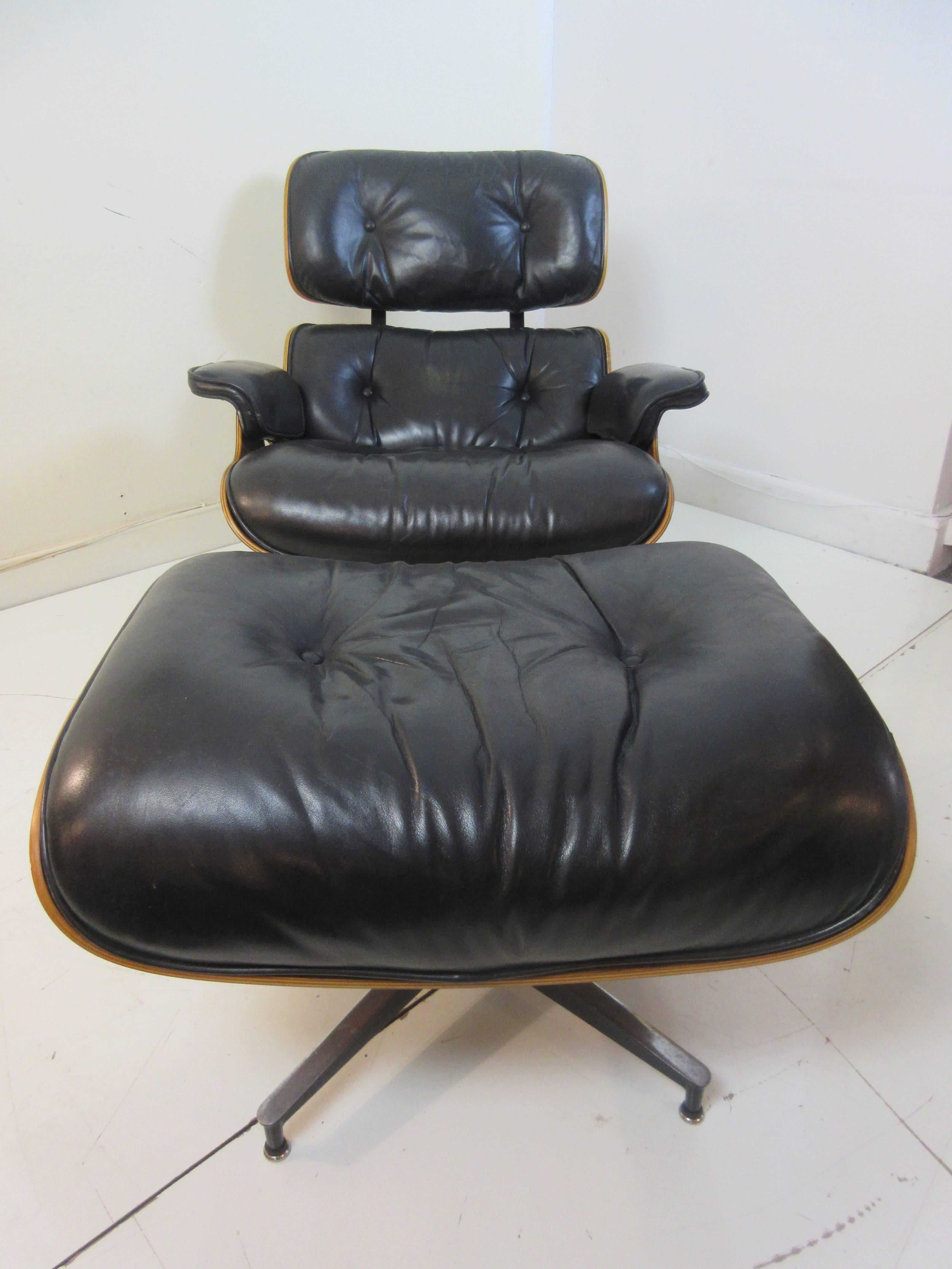 Charles Eames rosewood 670/71 chair and ottoman for Herman Miller with exceptional original shiny leather. Label remains. This addition is from the 1970s. Wood and leather excellent.
