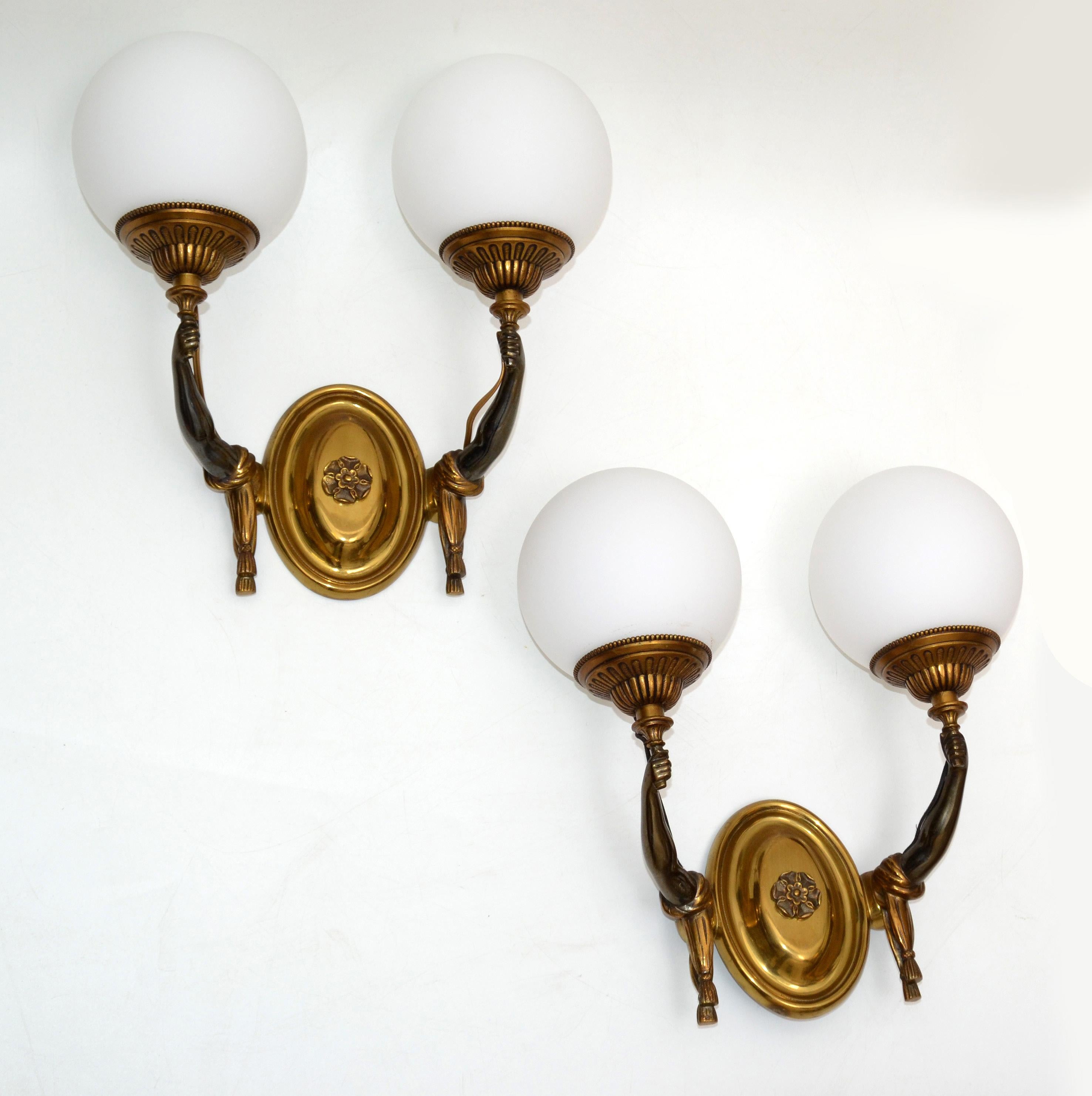 Pair of Charles et Fils bronze two arms holding up a round blown opaline glass shade. 
French neoclassical design wall light from the 1950s.
US wired and in working condition.
Measures: 13 inches H with shade, 10 inches H without shade.
Back