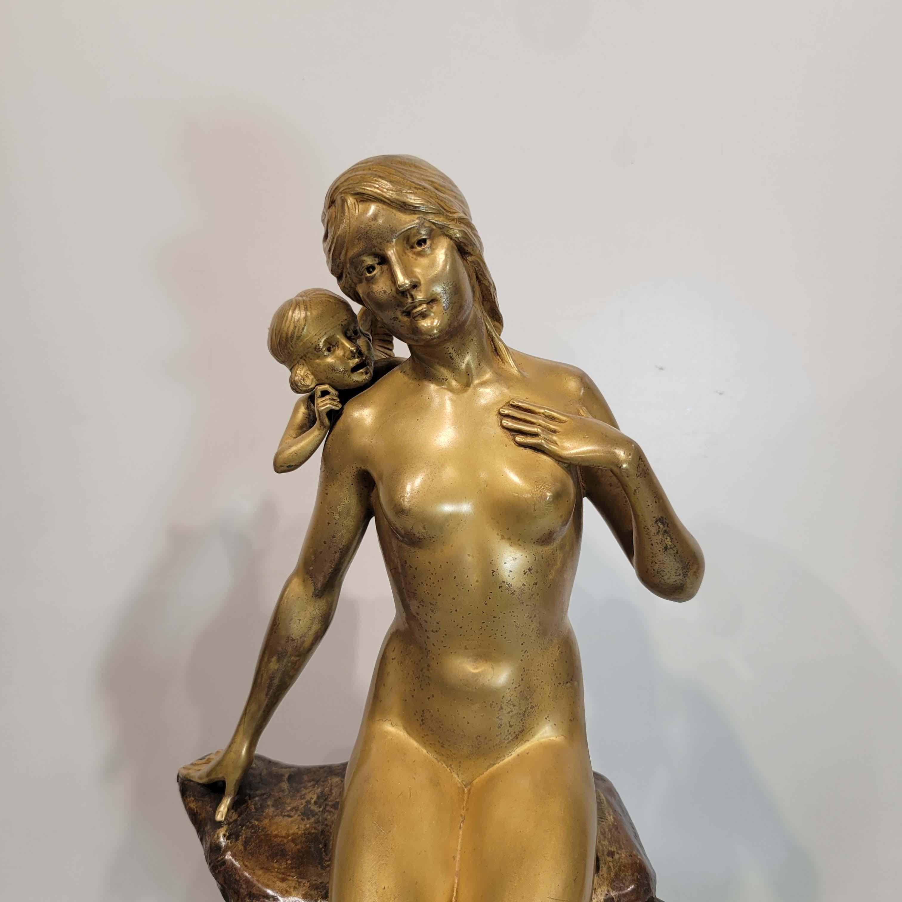 Charles-Eugène Thienot was a highly respected French jeweller, sculptor and Art Noveau artist who exhibited at the prestigious Paris Salon, circa 1900.
This bronze group depicts a beautiful nude nymph listening to a putti whispering in her right