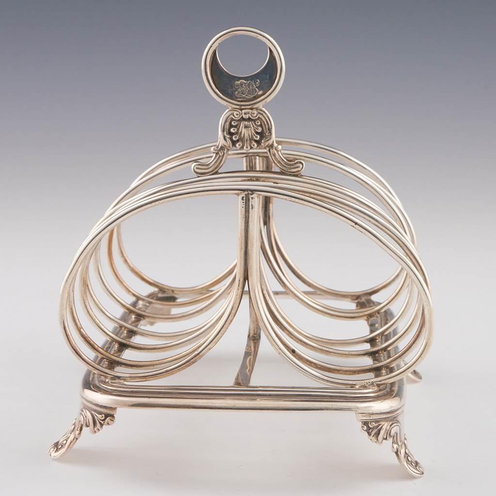 Heading : Sterling silver toast rack
Date : Hallmarked in London in 1833 for Charles Fox II
Period : William IV
Origin : London. England
Decoration : Six divisions with double loop dividers. Ring ‘omega’ handle with scrolled acanthus leaf and