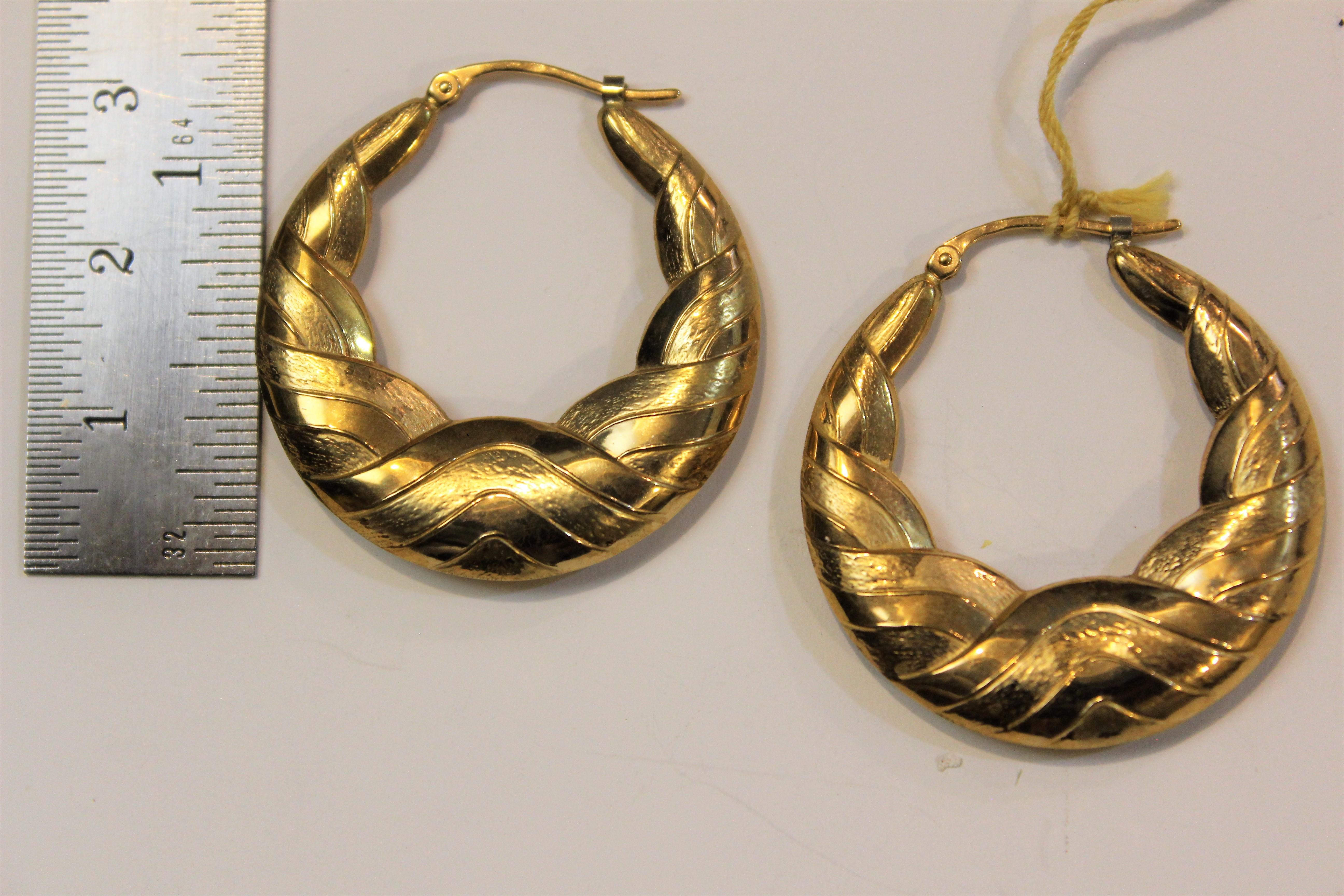 This is one of many Charles Garnier from Paris,  18 karat yellow gold hollow hoop earrings.
This collection is from a close out store with its left over stock still in the safe.
Circa 1980's
This designs are extremely detailed with light weight easy