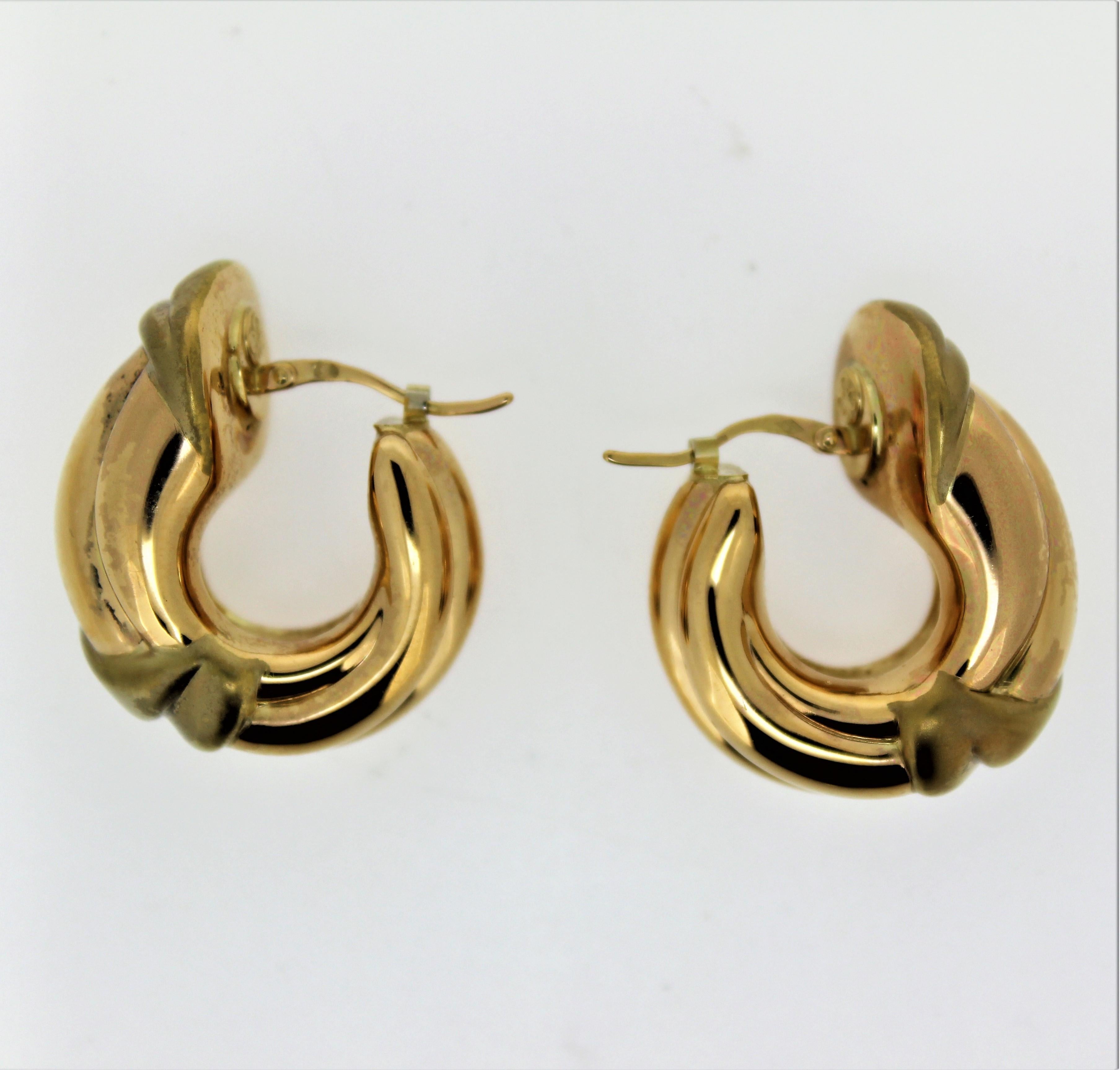 This is one of many Charles Garnier from Paris,  18 karat yellow gold hollow hoop earrings.
This collection is from a close out store with its left over stock still in the safe.
Circa 1980's
This designs are extremely detailed with light weight easy