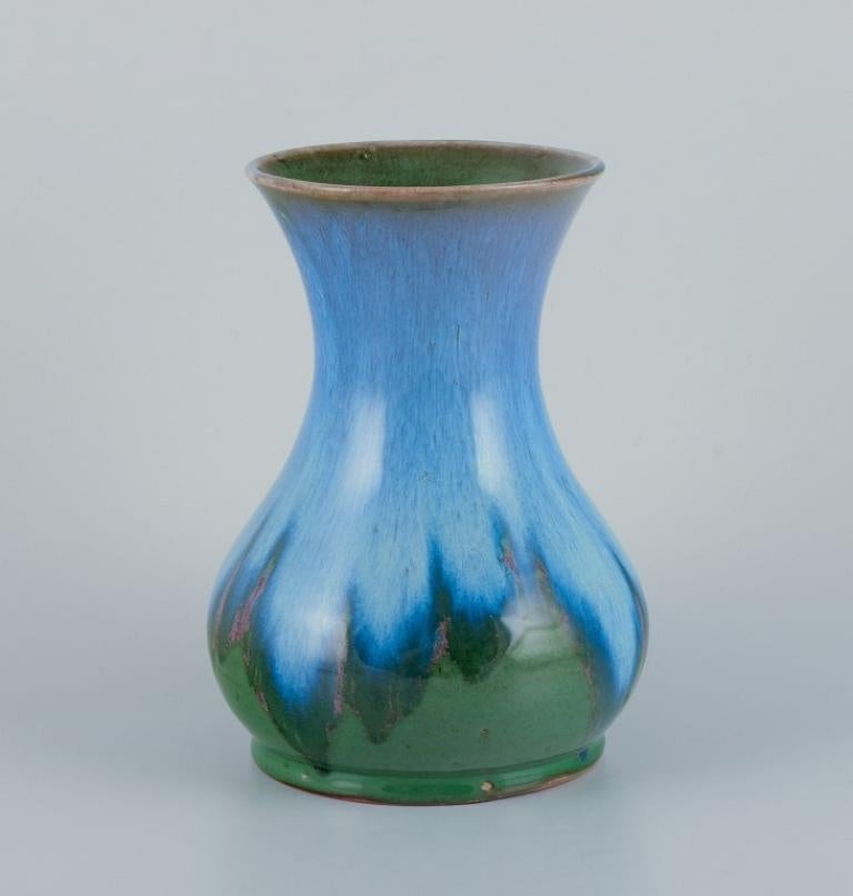 Charles Greber, Beauvais, France.
Ceramic vase with glaze in blue and green tones.
Mid-20th century.
Perfect condition.
Marked.
Dimensions: H 21.0 cm x W 15.0 cm.
