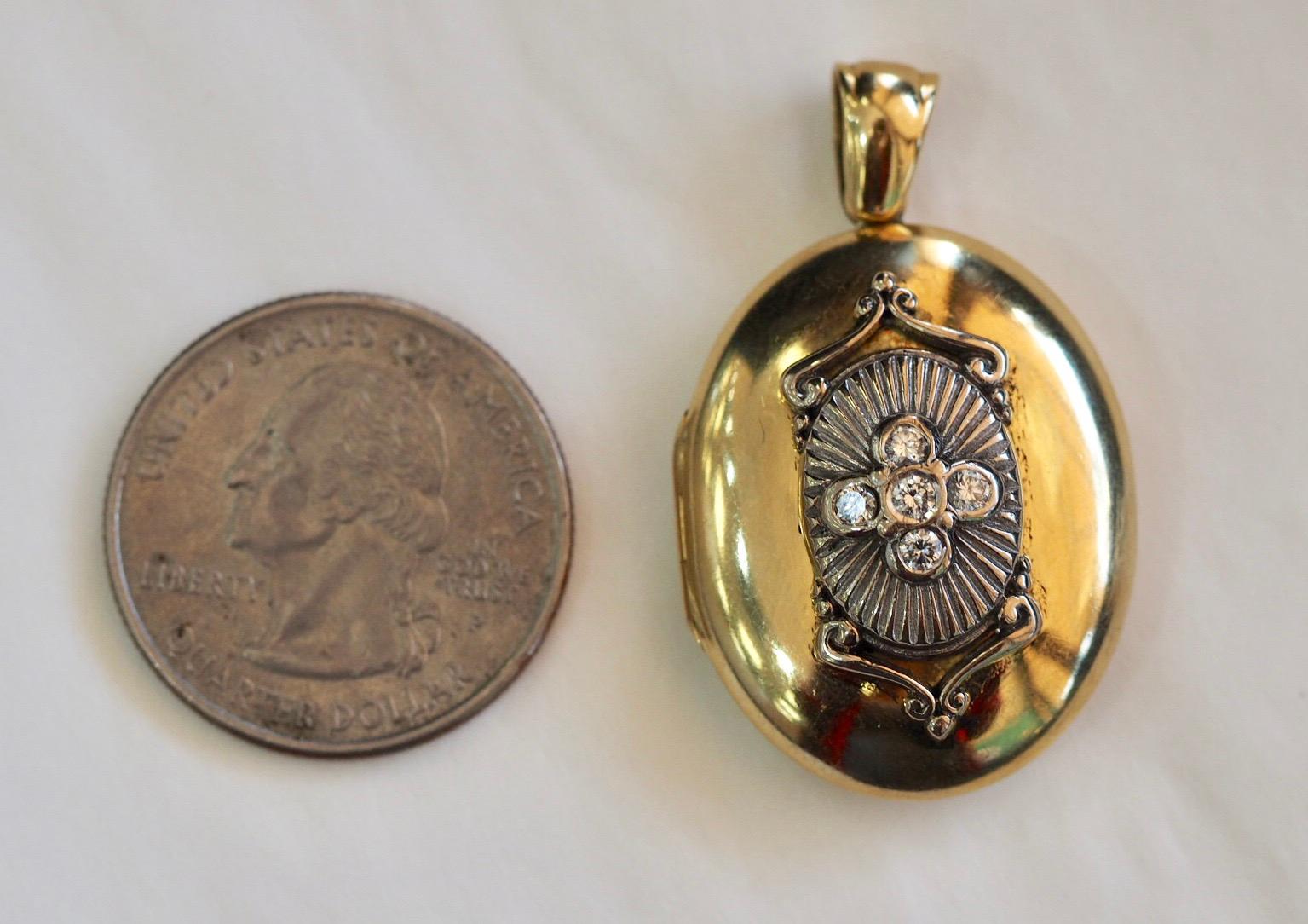 Vintage Charles Green & Son 18 Karat Yellow Gold and Diamond Locket is absolutely stunning. It measures 38.50 mm X 23.5 MM X 12.45 MM. It weighs 20.3 grams. The center has a a beautiful intricate design in 18 karat white gold where there are five