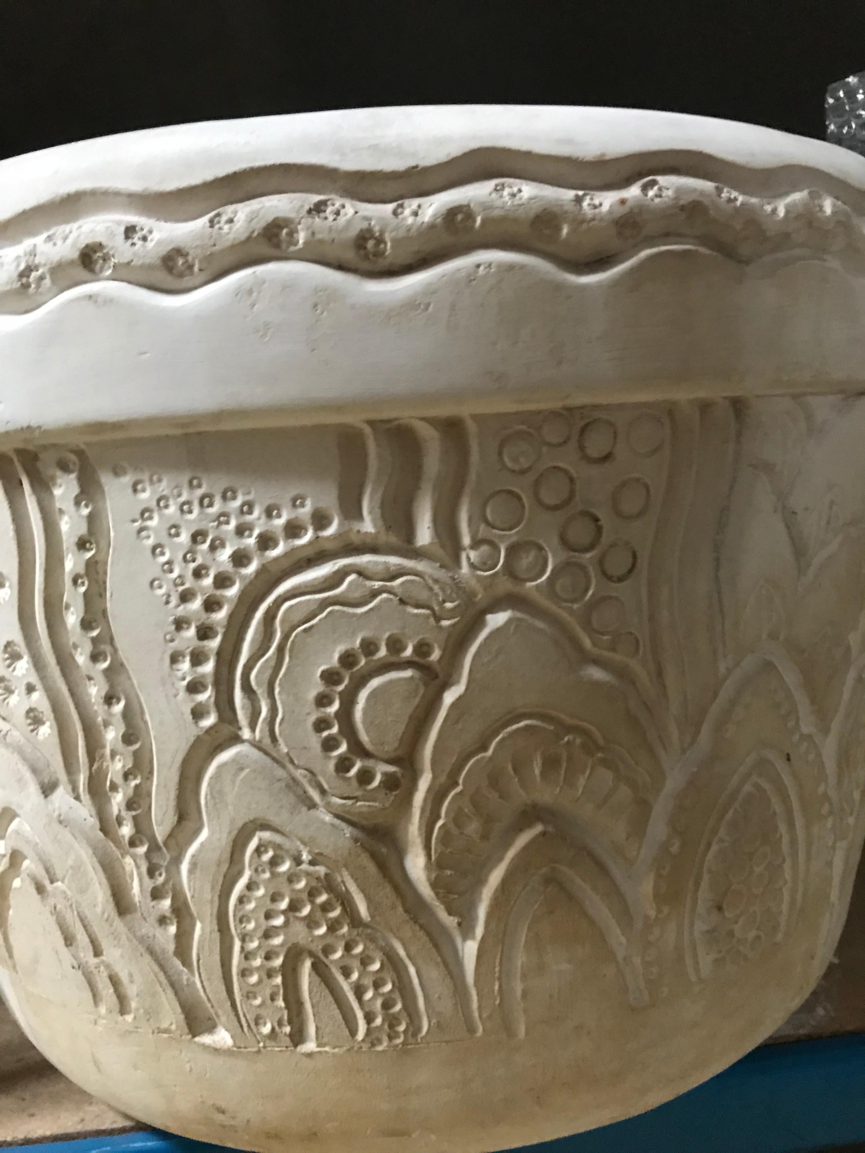 Rare pair of two magnificent large flower-pots in plaster with a engraved decor of bubbles, seaweeds and stylized waves. (Stains and loss).
Signed on the side.

Provenance : 
- Château de Larnagol
- Collection Raymond Subes