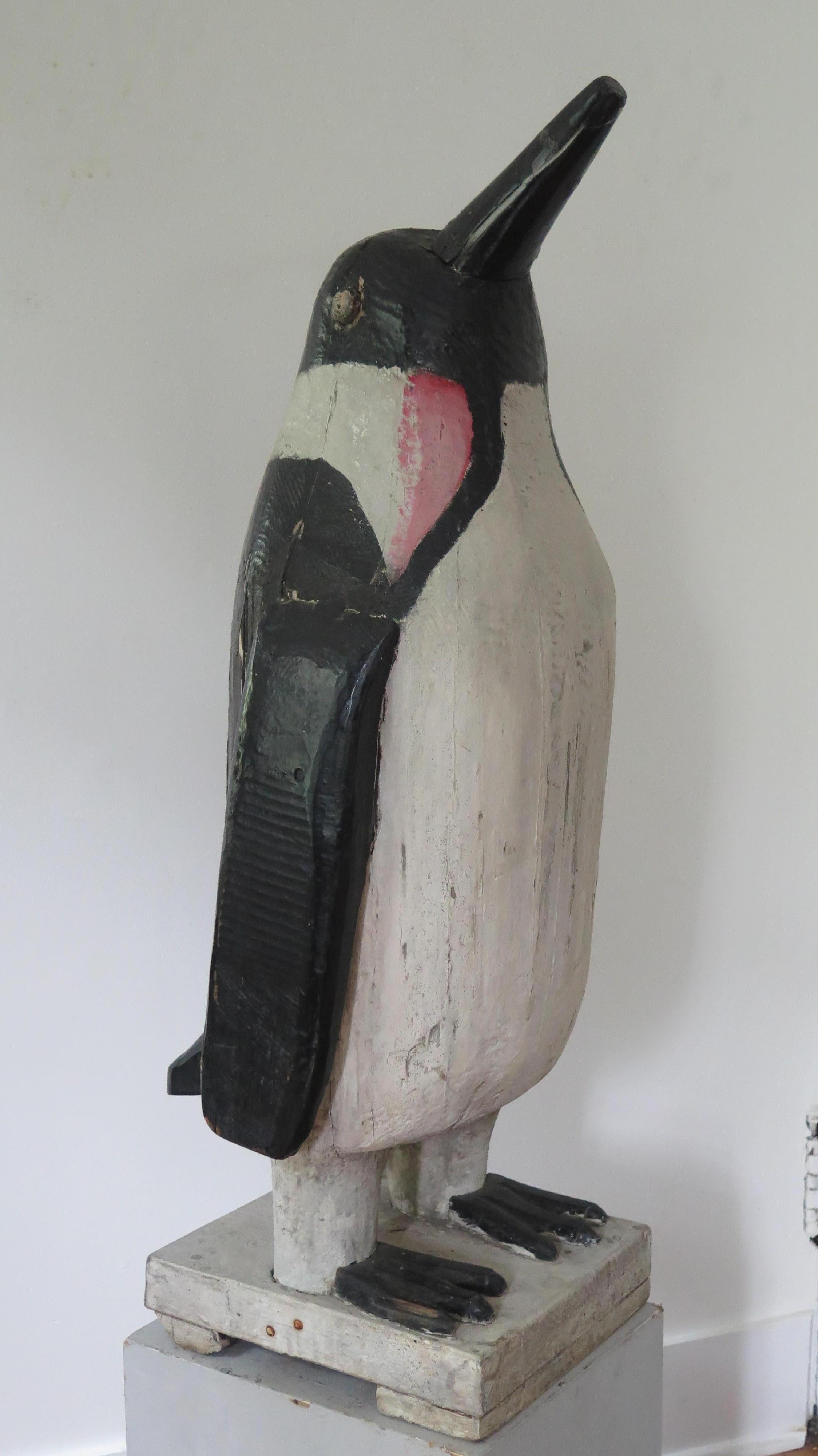 Charles Hart (1862-1960) was a stone contractor and mason in Glouchester, Massachusetts who became known as a carver of fine duck decoys. Hart also had a passion for penguins which he carved in different sizes. This is one of his larger penguin