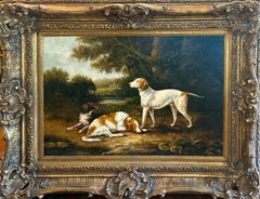 Two Spaniels and a Hound in wooded early 19th C landscape