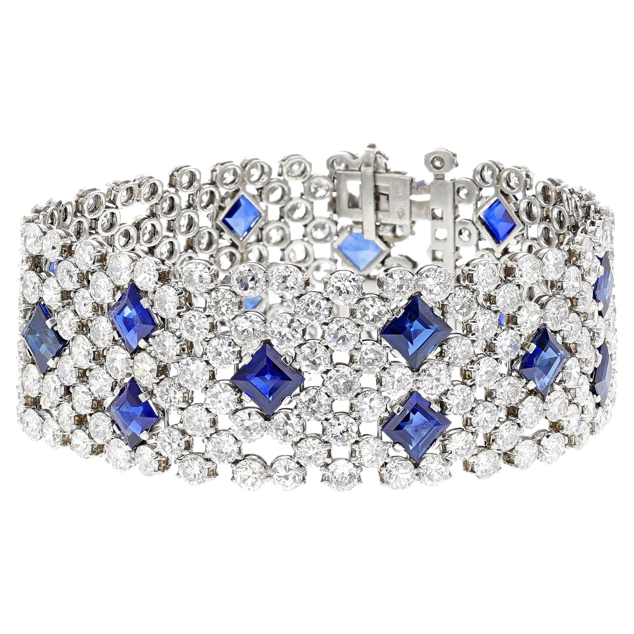 A stunning Blue Sapphire and Diamond Bracelet made in Platinum by Charles Holl, a French jewelry designer for Cartier and Van Cleef & Arpels. The bracelet weighs approximately 64.59 grams. The length is 7.10 inches and the width is 0.90