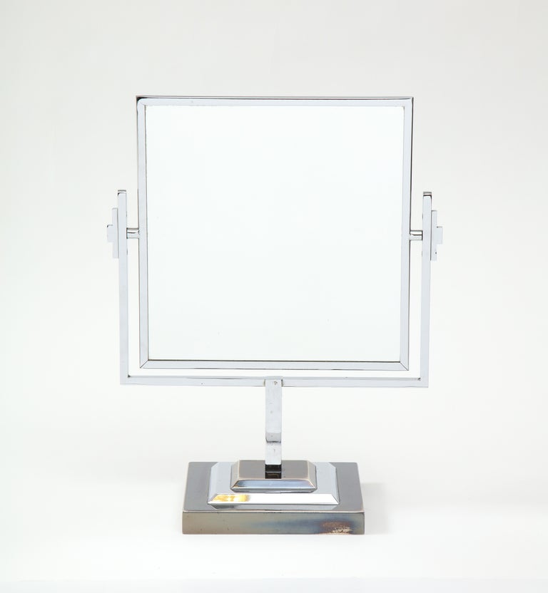 1970s well made and heavy chrome vanity mirror attributed to Charles Hollis Jones, with two-tone chrome base and double sided mirror.