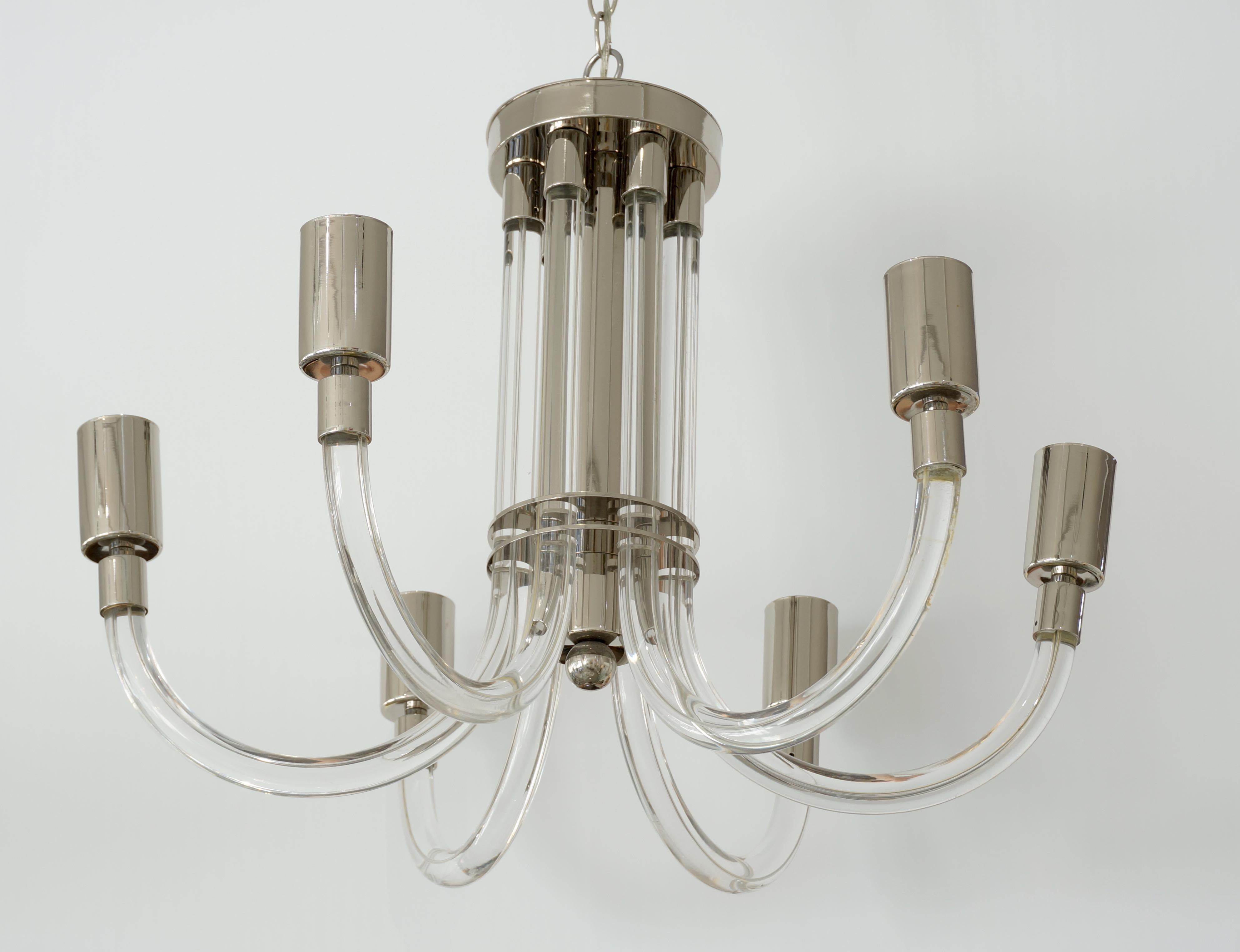 This stylish lucite and chrome chandelier dates to the 1970s and was designed by Charles Hollis Jones. 

Note: The mirror/top light bulbs shown in the photos are not included with the chandelier purchase.

Note: Requires six Edison based light