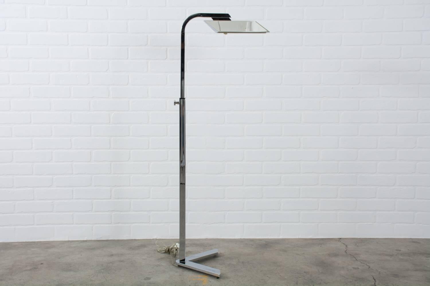 This Mid-Century Modern adjustable floor lamp was designed by Charles Hollis Jones in the 1970s, USA. It is constructed of chrome plated steel and has a 'V' base. The height can be adjusted from approximately 36 inches high to 48 inches high. Dimmer