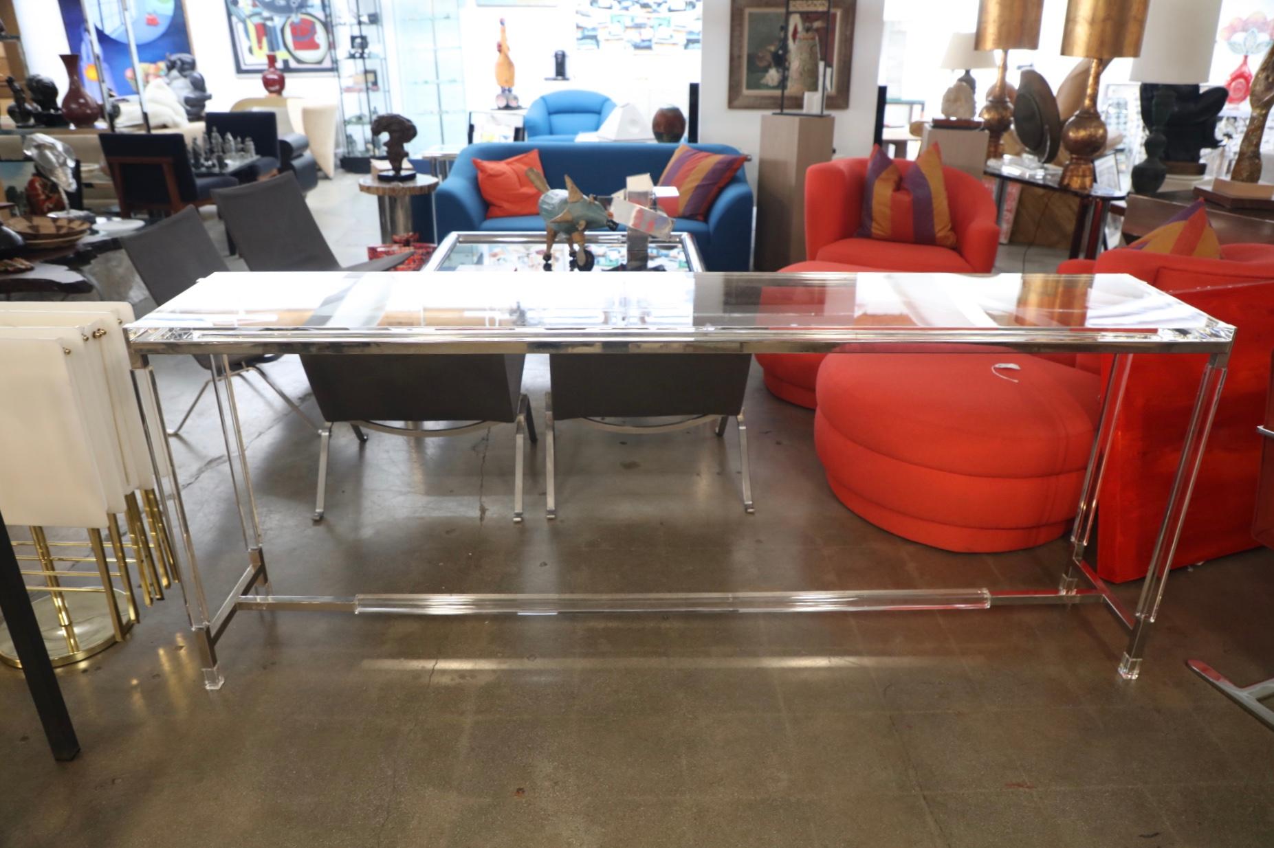 A Charles Hollis Jones nickel and Lucite 7 foot long console table. This table is new and custom made to order. It is available in nickel or brass finish. It will be signed and dated if requested.
