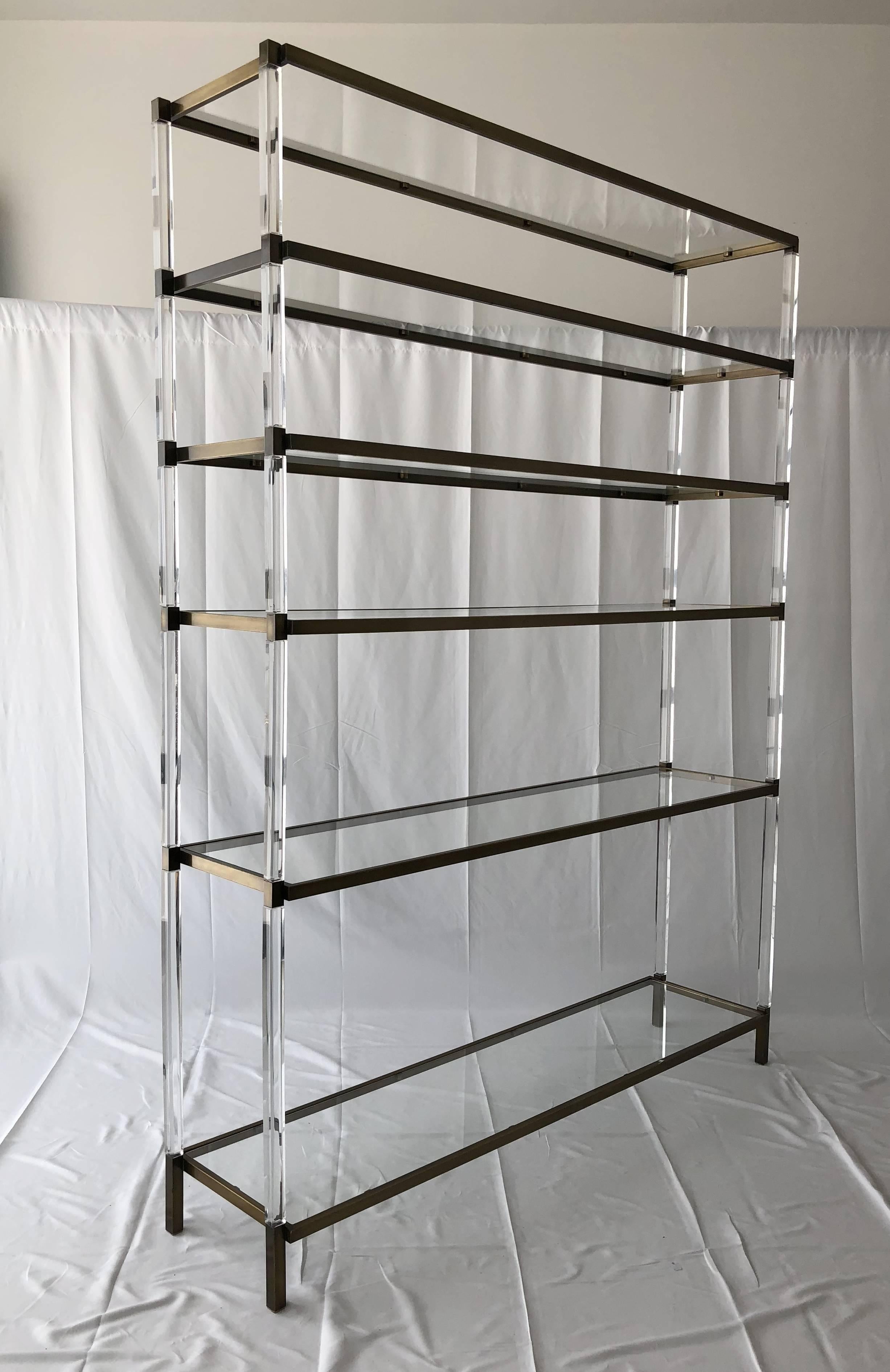 Stunning Lucite and brass étagère/shelving unit designed and manufactured by Charles Hollis Jones.
This shelving unit was designed and manufactured in 1966 during his time with Hudson Rissman and it was a custom piece for a particular client.
The