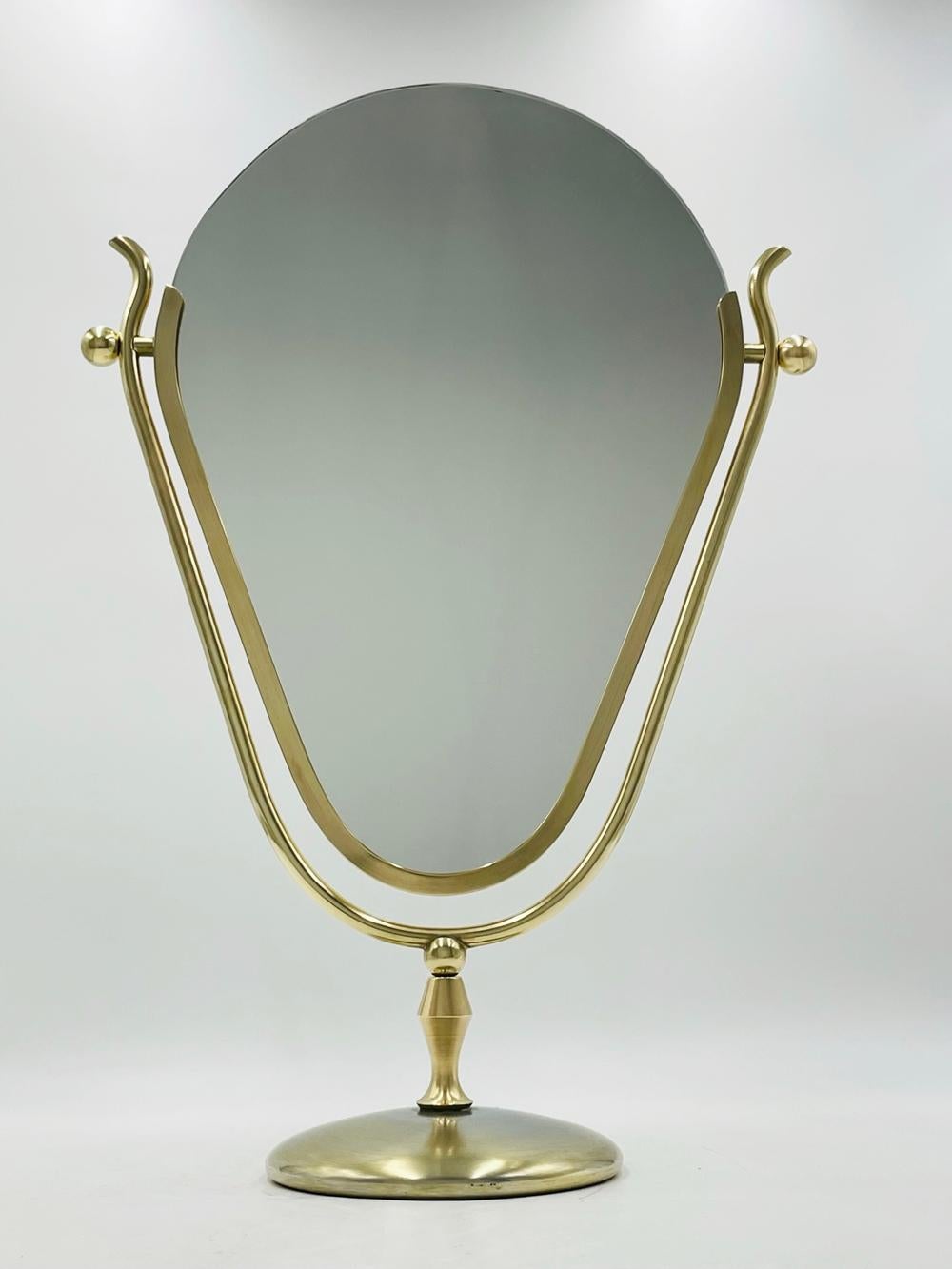 Introducing the Dual Side, Vanity Mirror in Brass by Charles Hollis Jones, Signed - a breathtaking addition to your decadent vanity space. Crafted with meticulous attention to detail, this mesmerizing mirror is a true testament to the designer's