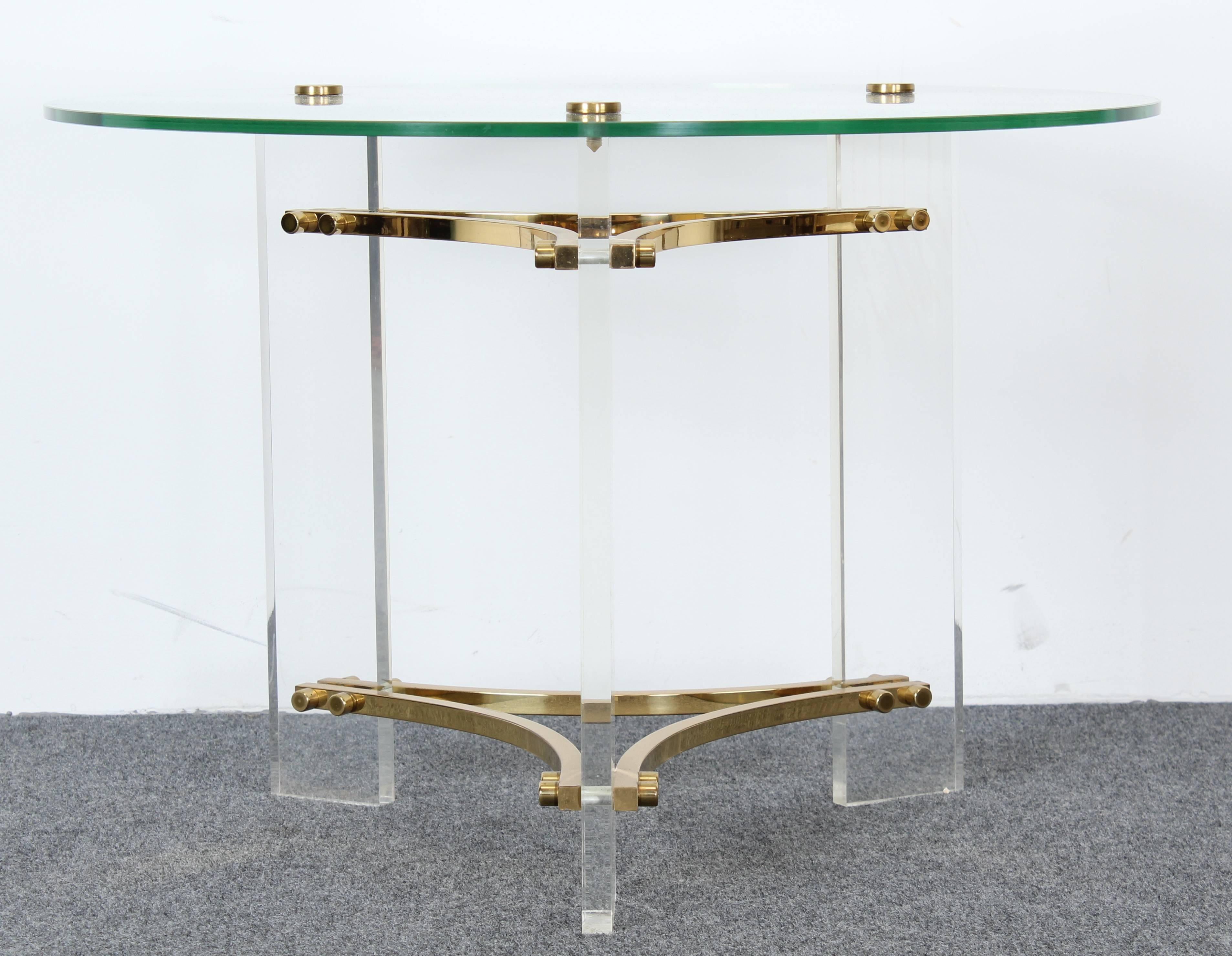 A luxurious Lucite and brass side table with glass top by Charles Hollis Jones. Table is in very good condition with age appropriate wear.