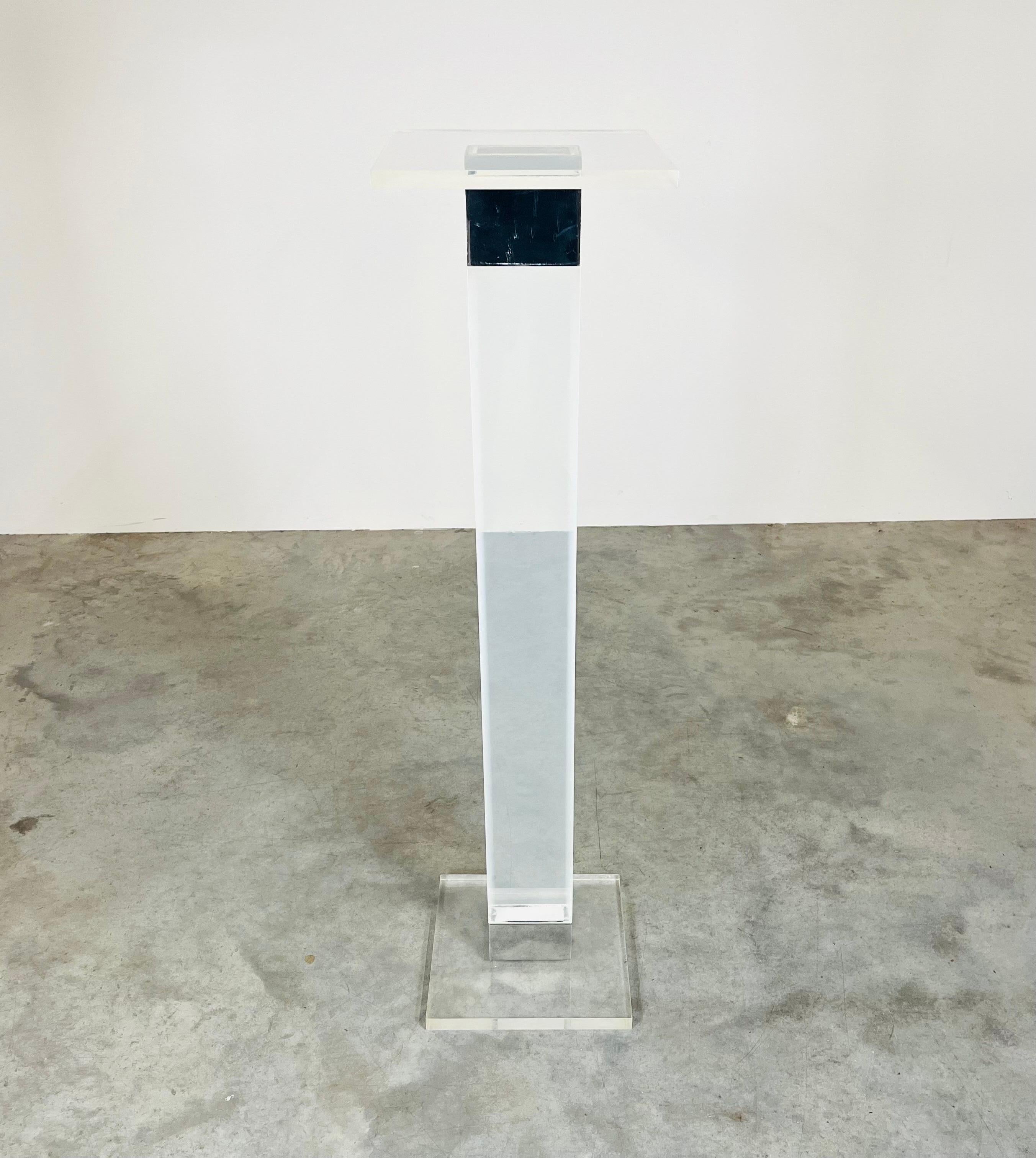 A beautiful polished nickel and solid lucite pedestal designed by Charles Hollis Jones circa 1960. In very nice overall condition having minimal signs of usage. Obtained from the original owners estate. 
Dimensions: 48x12x12” HWD