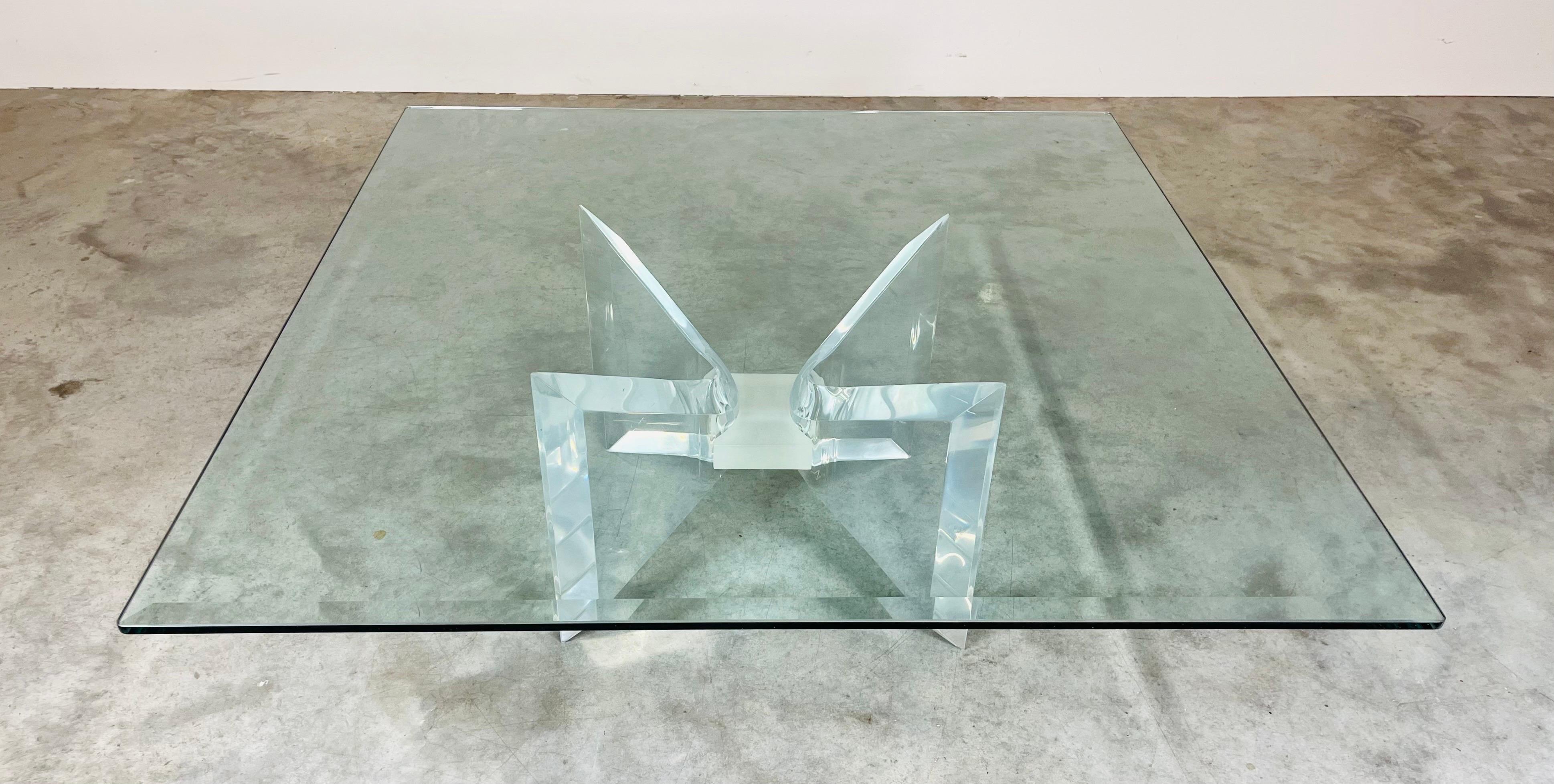 A beautiful lucite “Butterfly” cocktail table designed by Charles Hollis Jones having rare frosted center with sculptural lucite butterfly wings underneath of a 41.75” x 41.75” tempered glass top having a 1” taper around the edges.
In fantastic