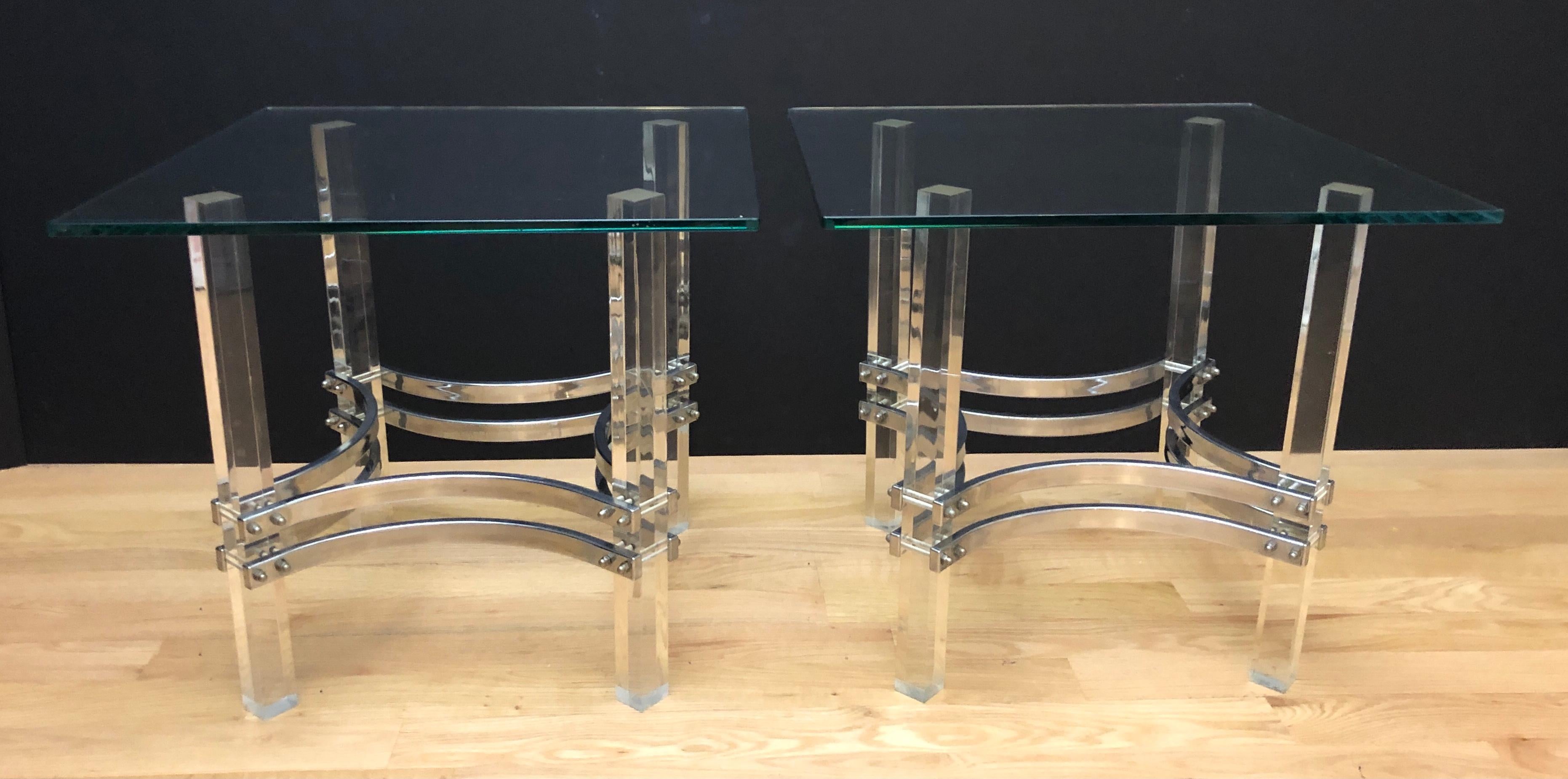 Pair of Charles Hollis Jones Mid-Century Modern Lucite chrome and glass side tables. Square lucite legs supported by curved chrome stretchers. Glass tops.