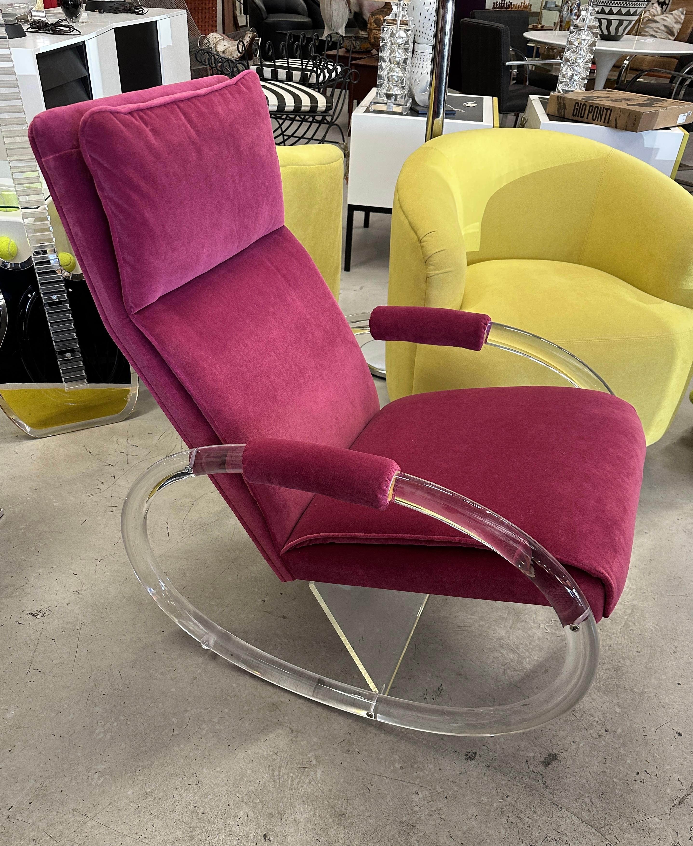 A pretty rocking chair designed by Charles Hollis Jones for Hill manufacturing in the 1970s. It has been beautifully reupholstered in a pink cotton velvet mohair. There are some minor marks and scratches to the lucite shell and bottom support.