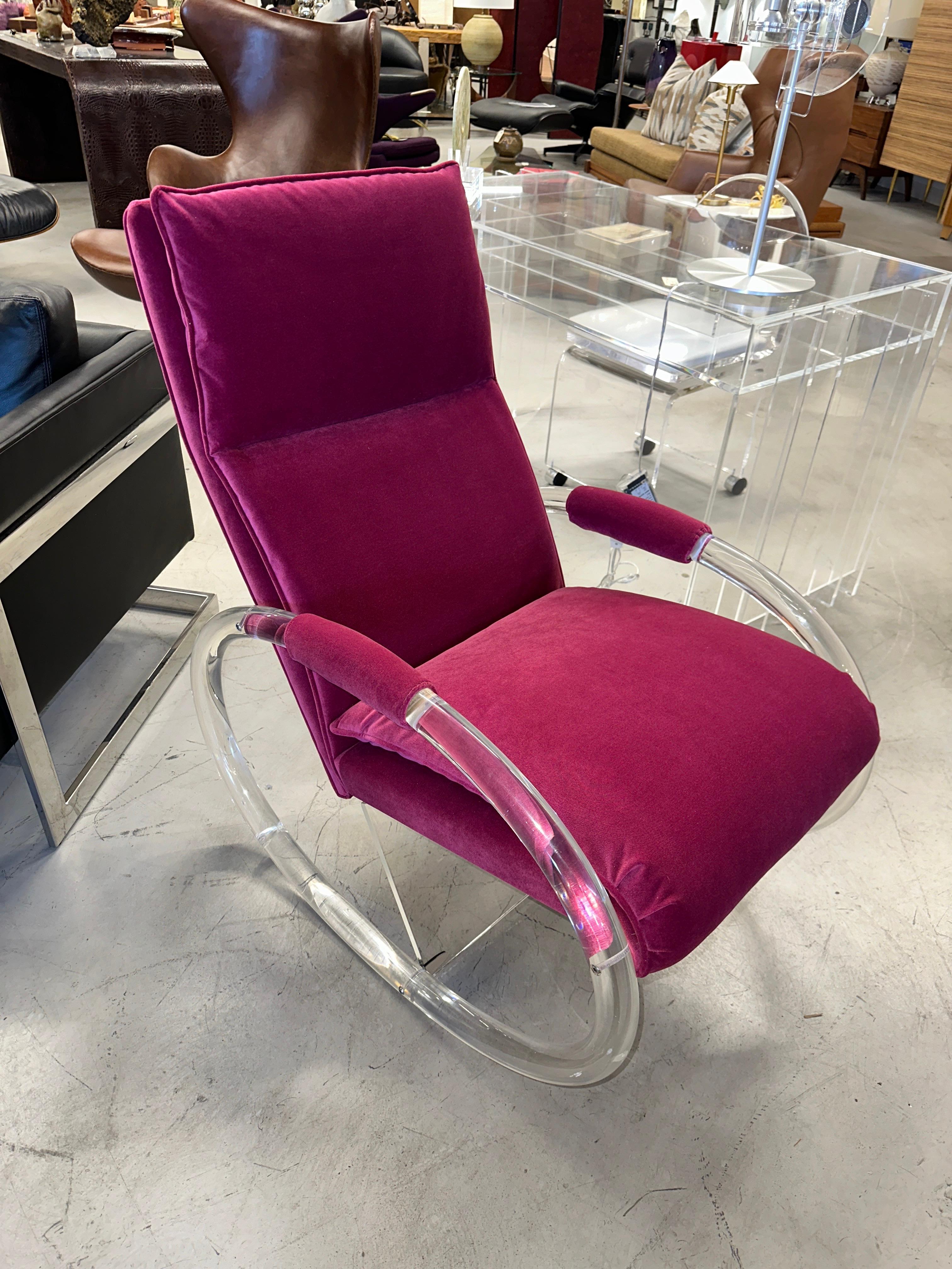 A pretty rocking chair designed by Charles Hollis Jones for Hill manufacturing in the 1970s. It has been beautifully reupholstered in a pink poly/cotton velvet. There are some minor marks and scratches to the lucite shell and bottom support. There