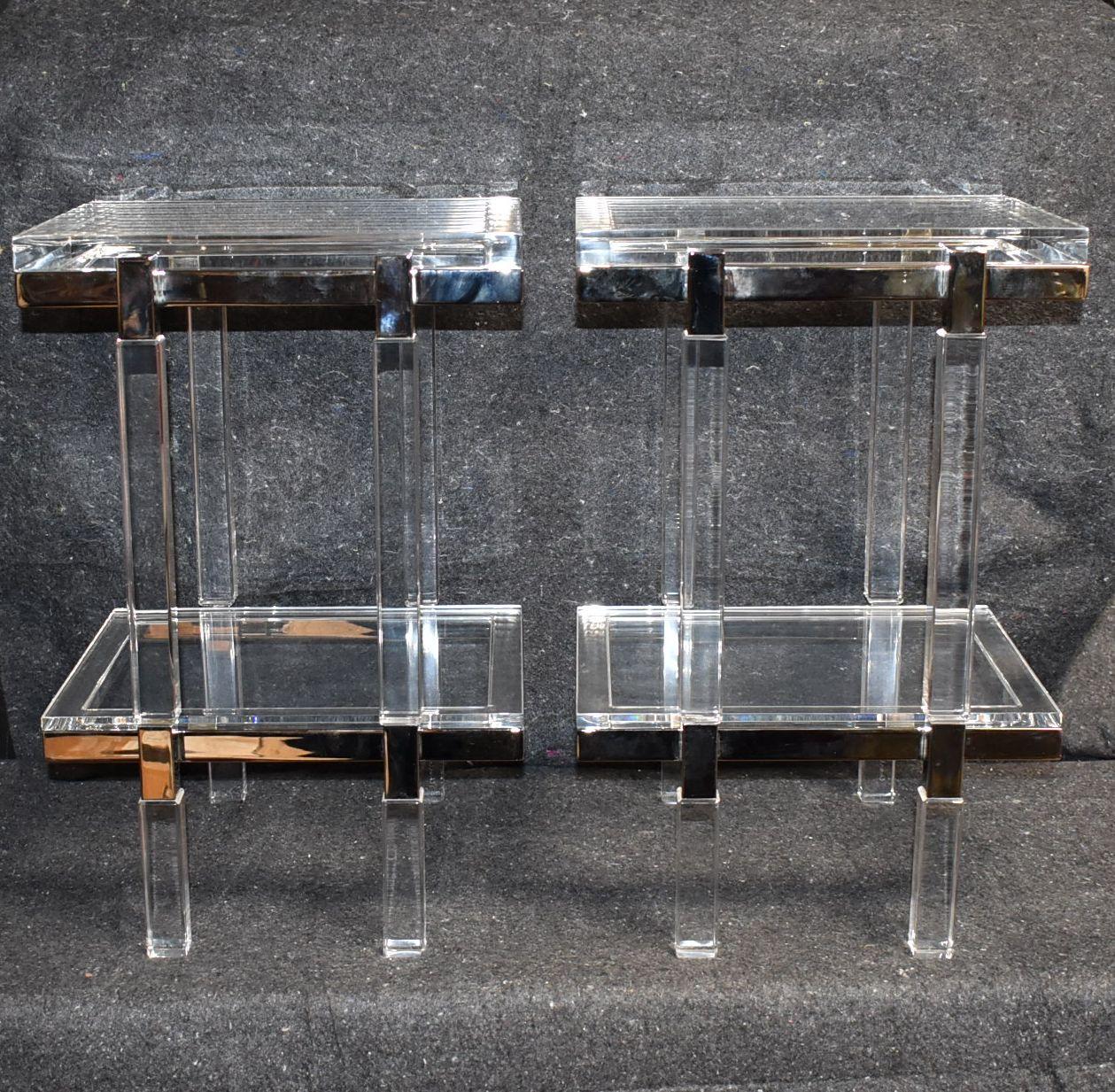 Two tiers lucite and polished nickel-plated end tables made and signed by Charles Hollis Jones. Provenance directly from artist private collection.