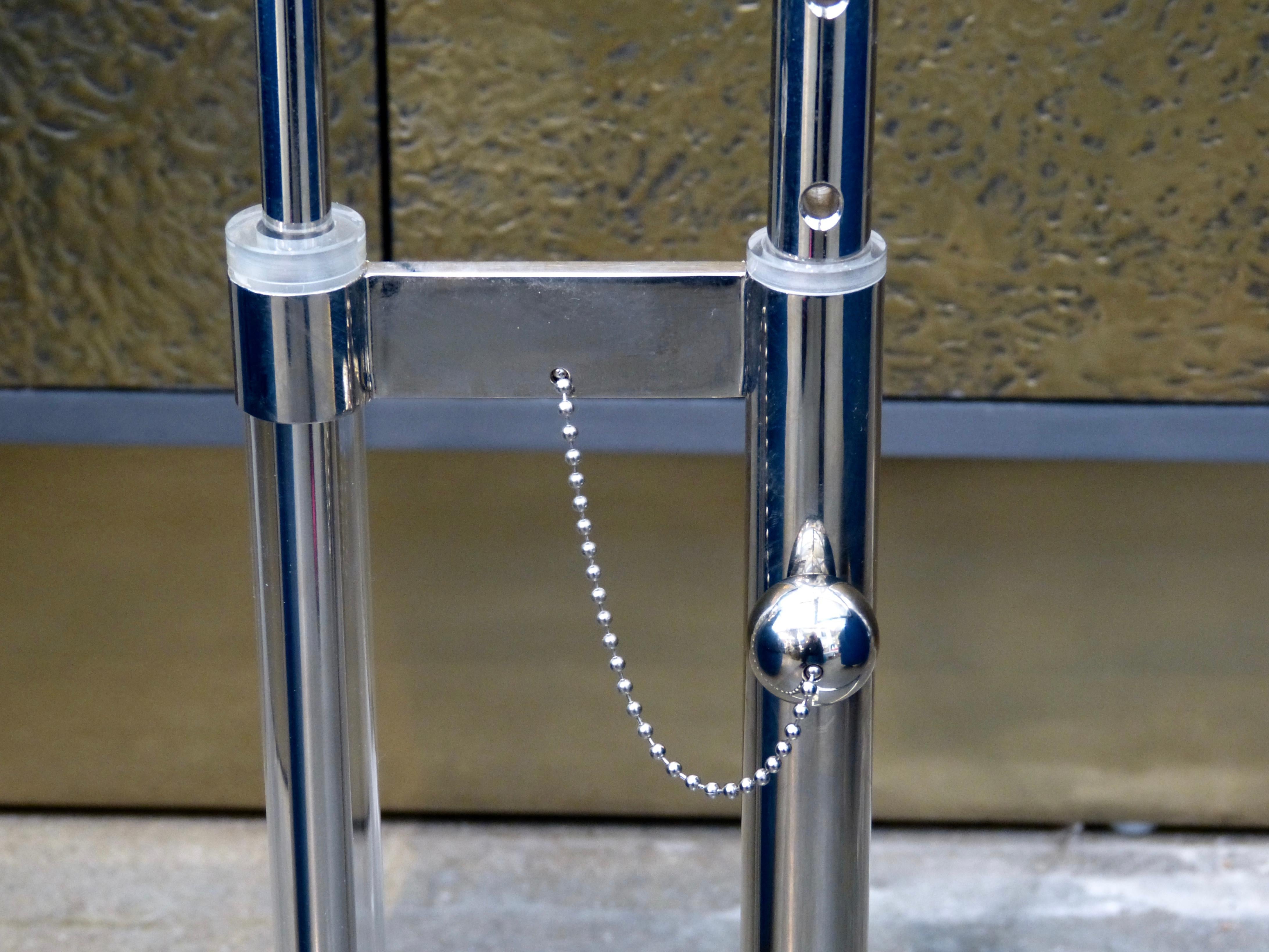 An unusual and very practical triangle table by Charles Hollis Jones. It features an adjustable base. Some slight handling marks and imperfections.