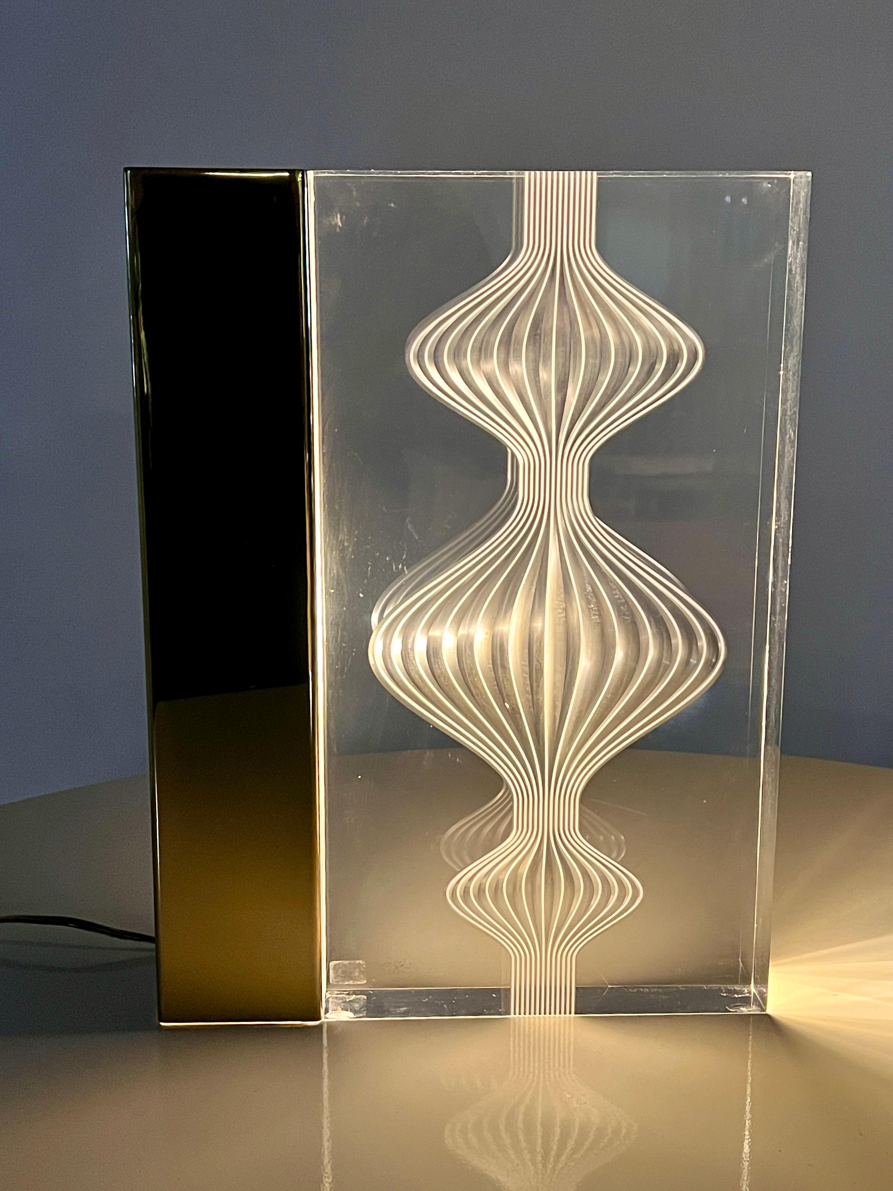 Rare and unique limited edition of a Charles Hollis Jones sculptural Lucite lamp. This high-style carved lucite block is a newer design by the artist Charles and has been modified into a lamp to illuminate the artist's mid-century inspired design