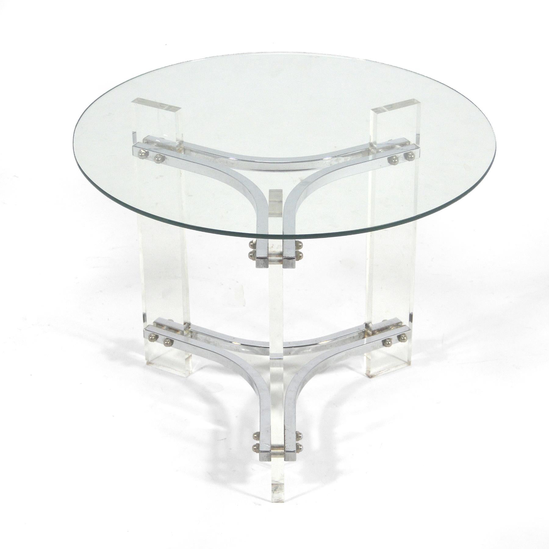 Similar to the works of Charles Hollis Jones, this sexy side table uses lucite slabs for legs joined by curved chrome stretchers.

20.5