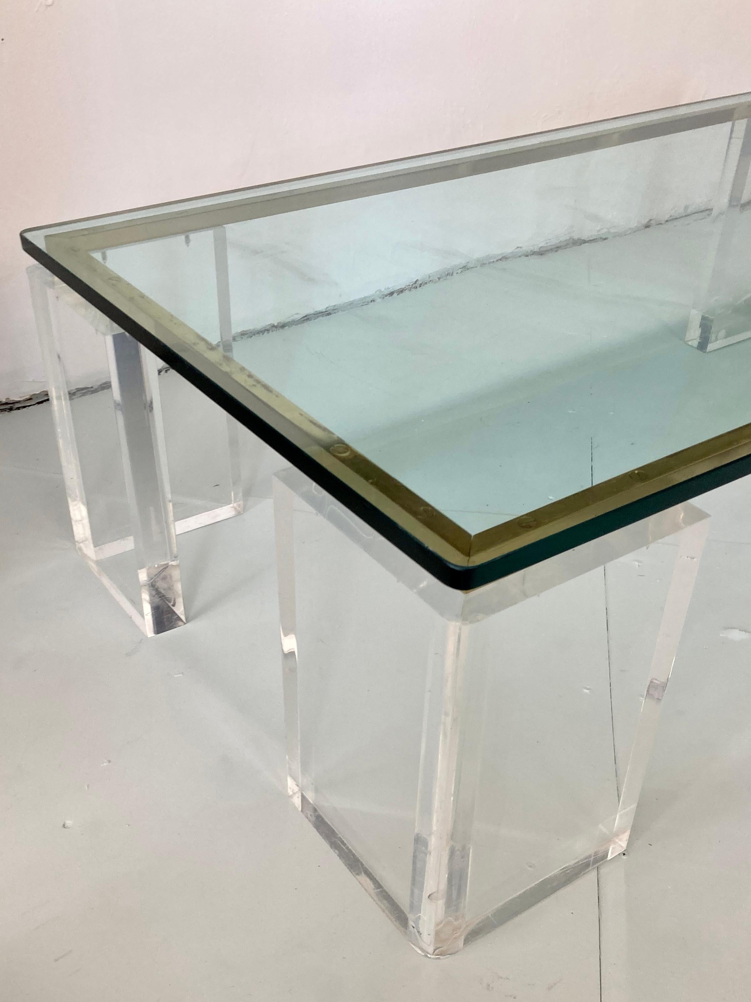 Late 20th Century Charles Hollis Jones Style Lucite Coffee Table With Brass Details For Sale