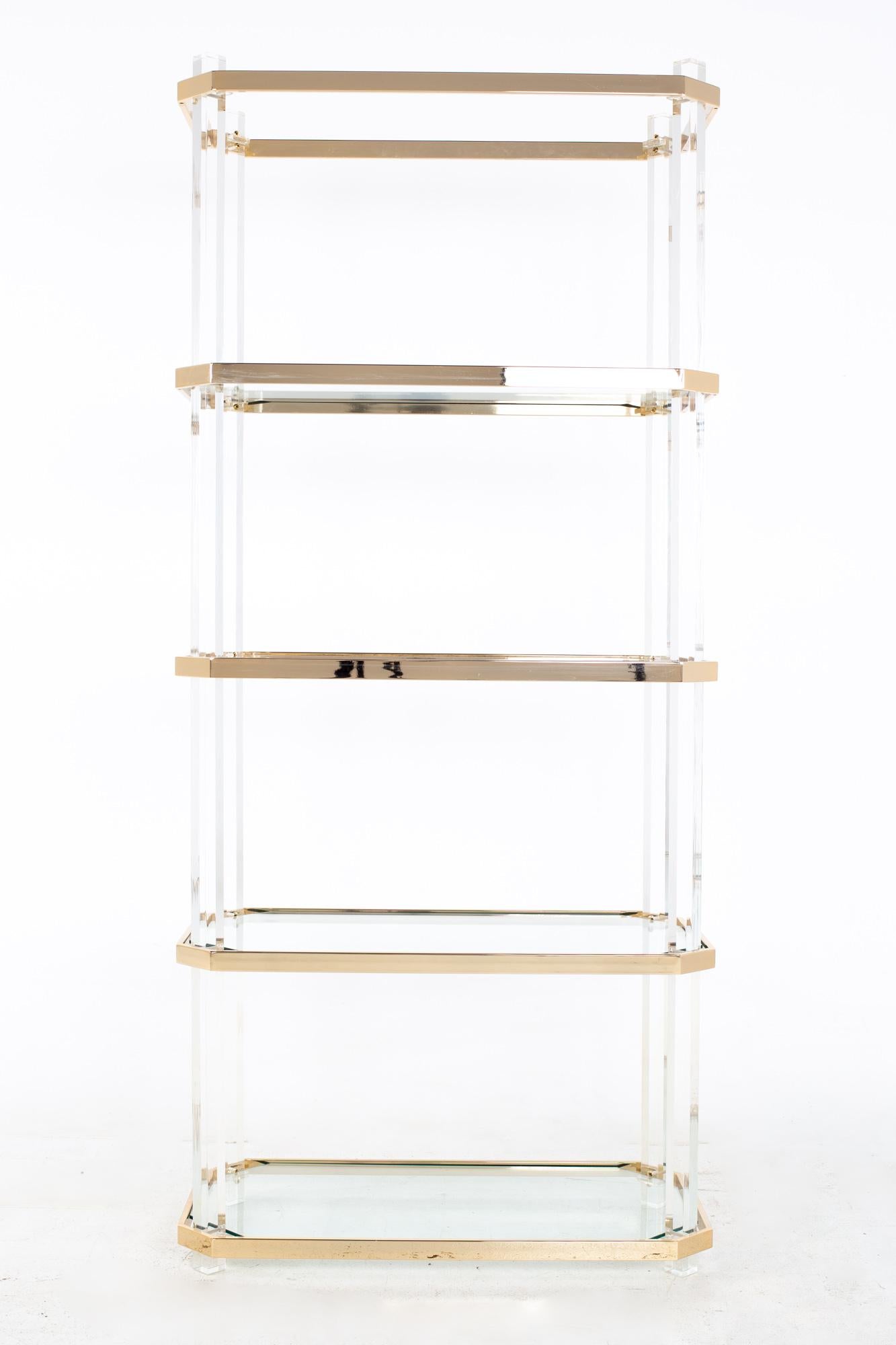 Charles Hollis Jones style mid century brass and lucite etagere
Etagere measures: 32 wide x 16 deep x 70 inches high

All pieces of furniture can be had in what we call restored vintage condition. That means the piece is restored upon purchase so