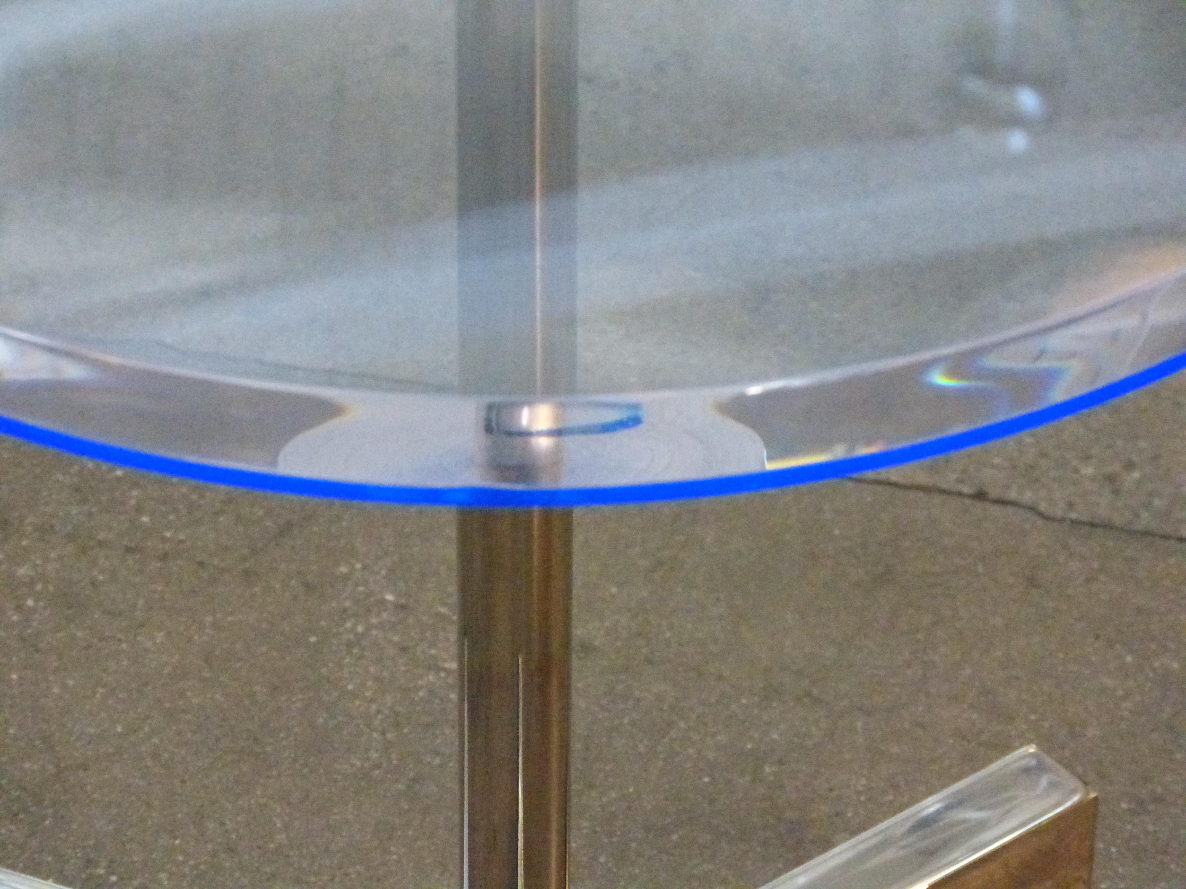 A beautiful side table designed by Charles Hollis Jones for Arthur Elrod, this table features a blue highlight to the underside of the Lucite top, and really pops on the edges. Some slight handling marks and imperfections.