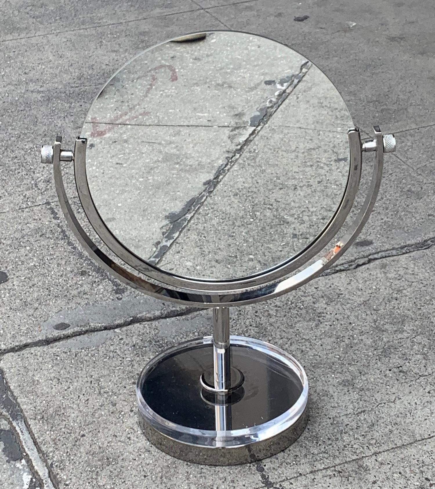 Beautiful two sided vanity mirror in polished nickel and Lucite by Charles Hollis Jones dating from the early to mid-1970s.
The mirror is in good vintage condition, minor wear due to age, no pitting or rusting and the mirror is in free of chips or