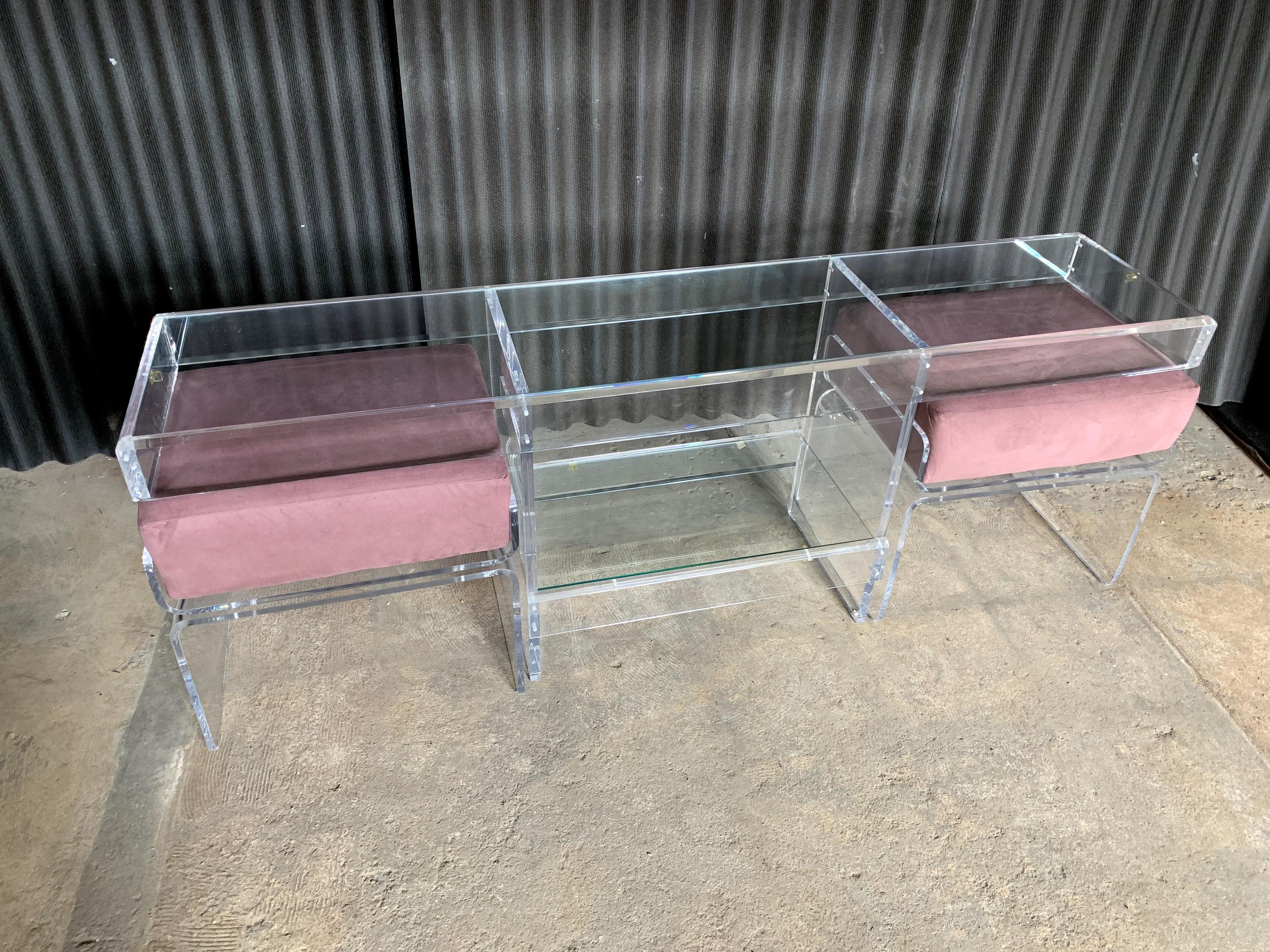 Like new, gorgeous Lucite two glass shelf consoles with 2 benches.

No cracks, no breaks, gorgeous mauve fabric, what's not to love?!
Perhaps a fine line here or there but cannot photograph.
These pieces appear like that was never touched.